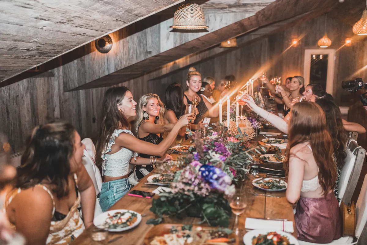 a group of people sitting at a table