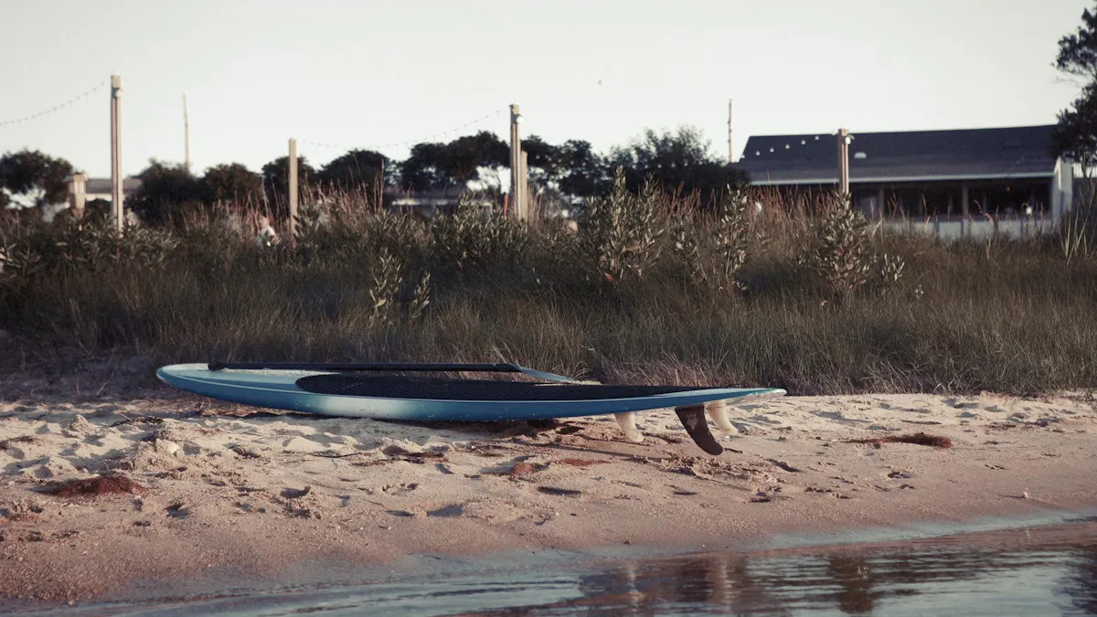a boat sitting on top of a sandy beach