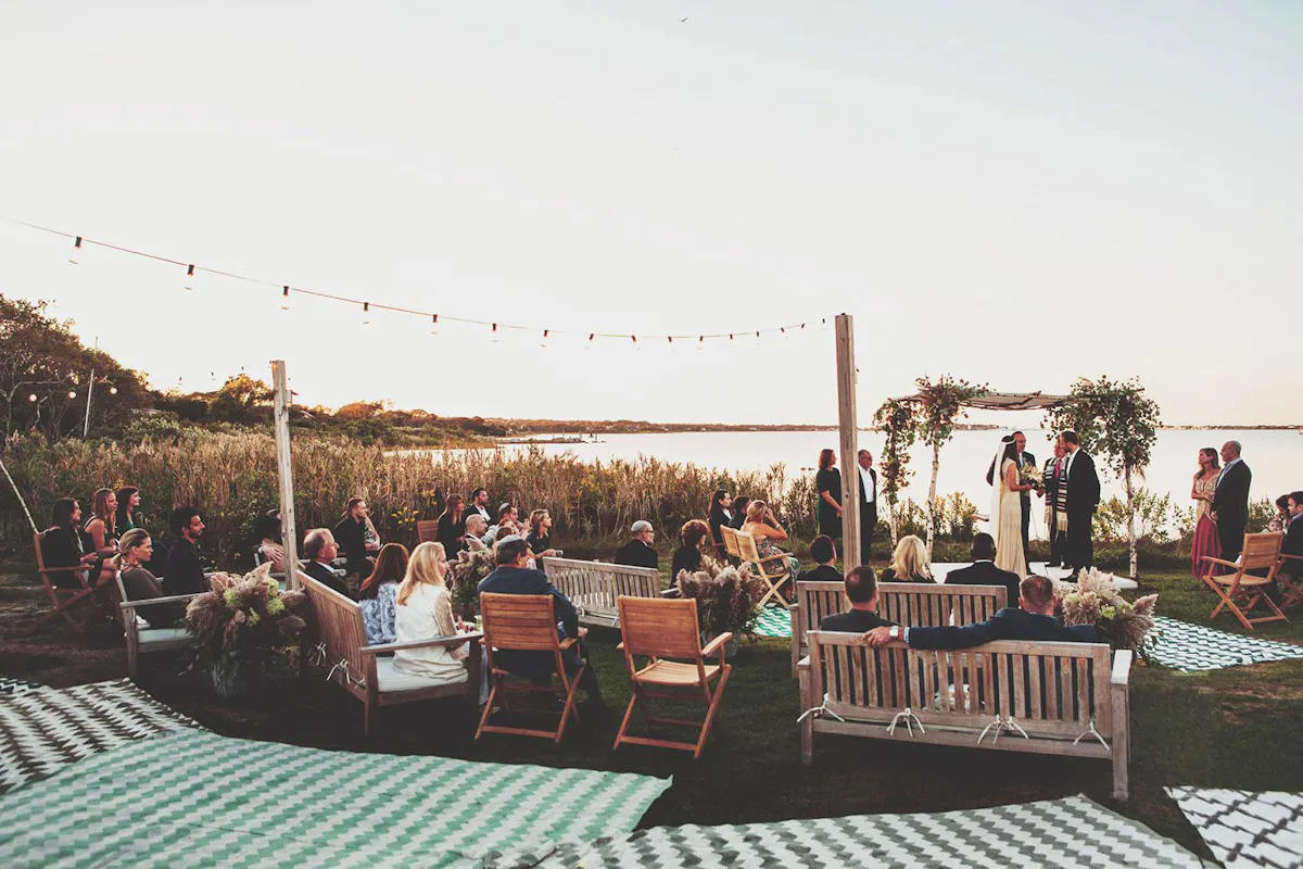 a group of people sitting at a table in front of a crowd
