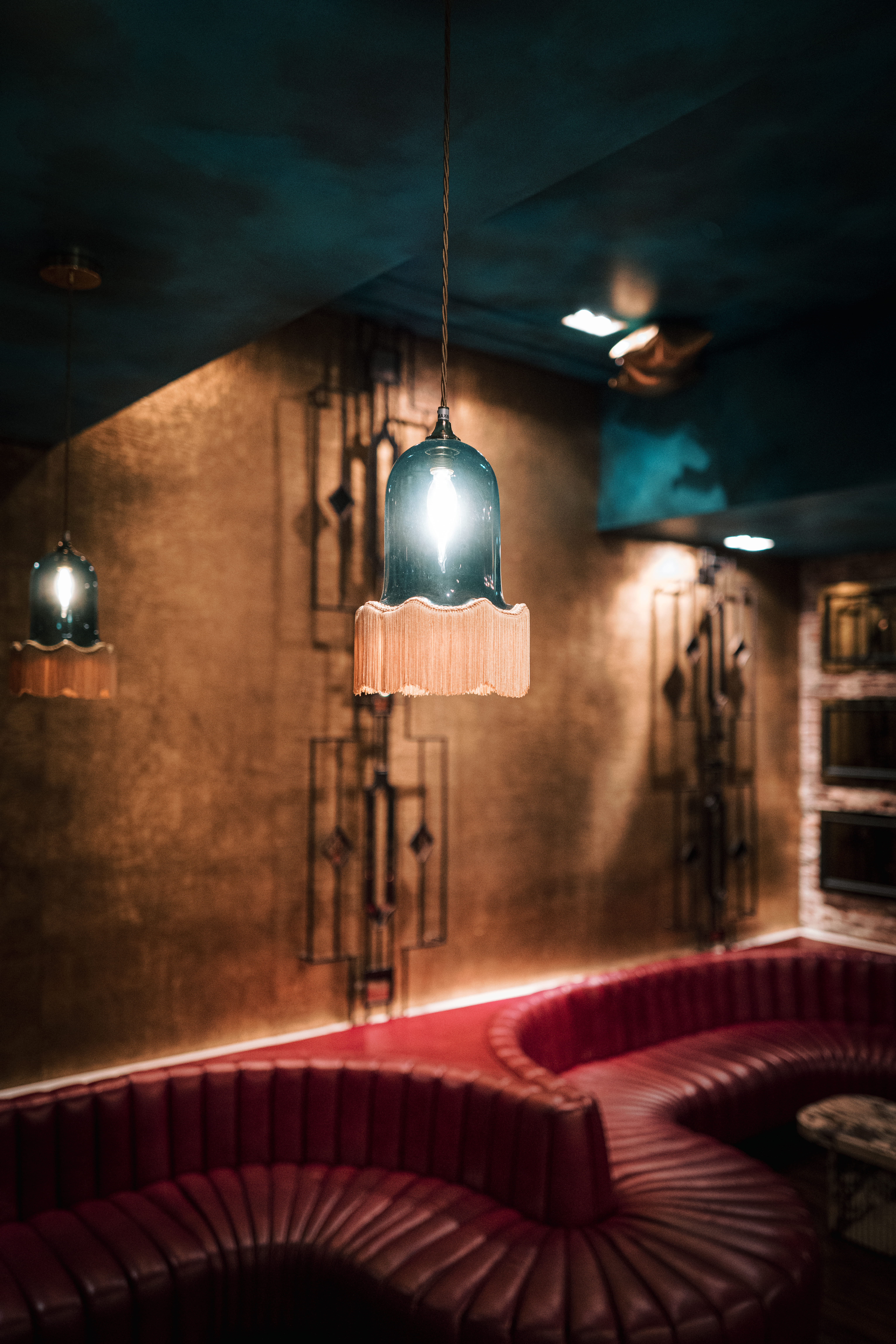 a view of a kitchen next to a fireplace in a dark room