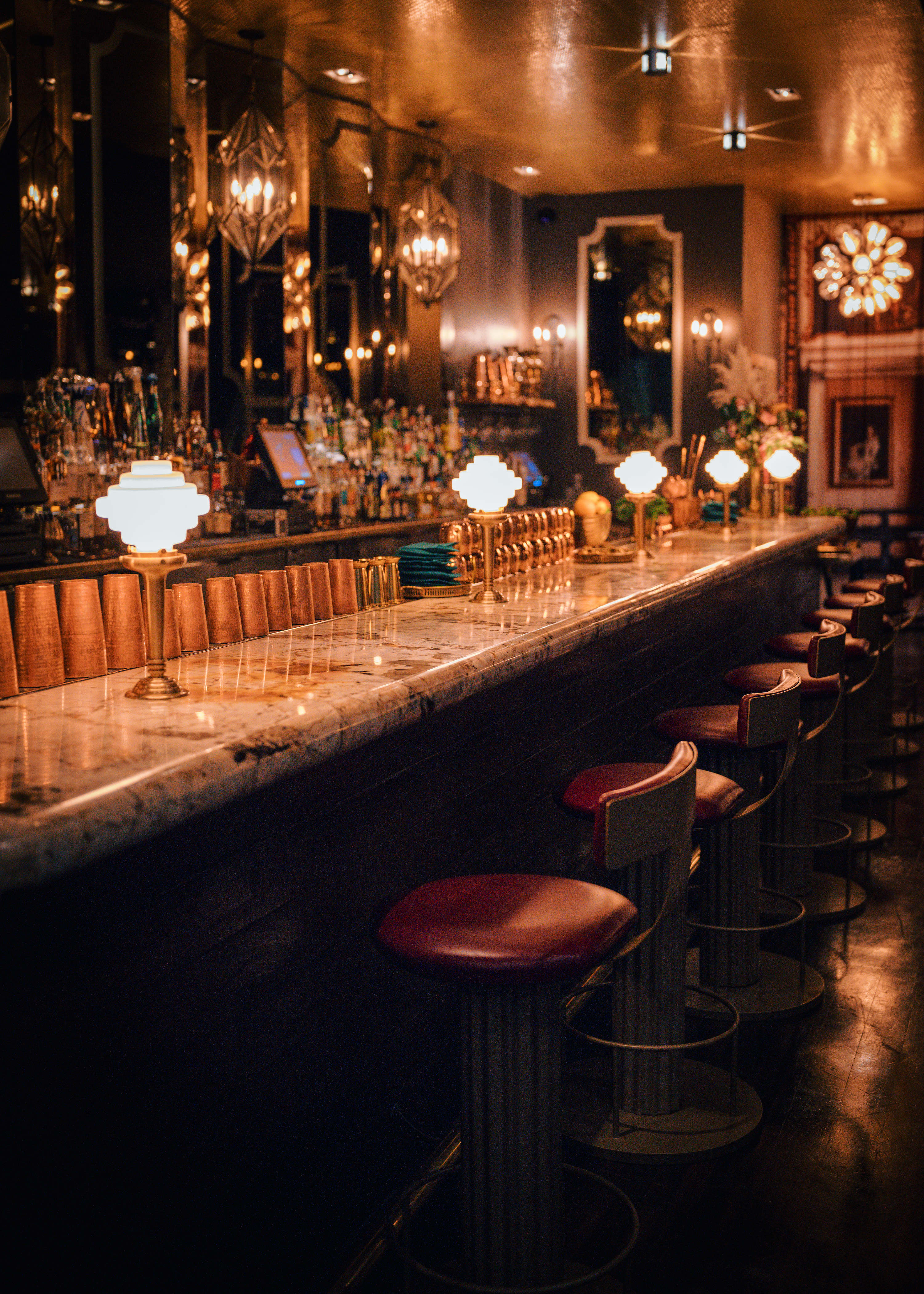 a group of people sitting at a table in a dark room