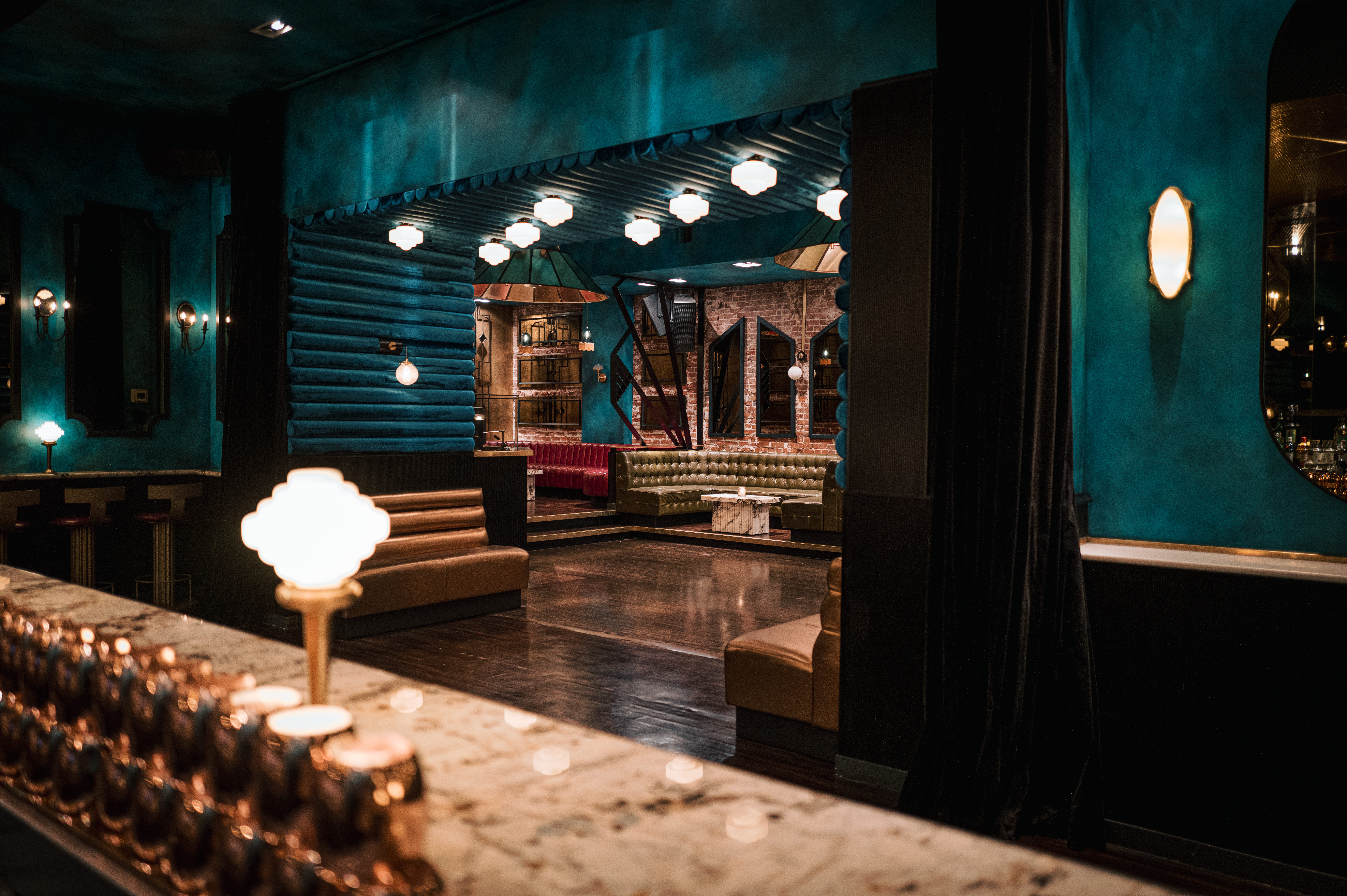 a glass with a blue light in a room