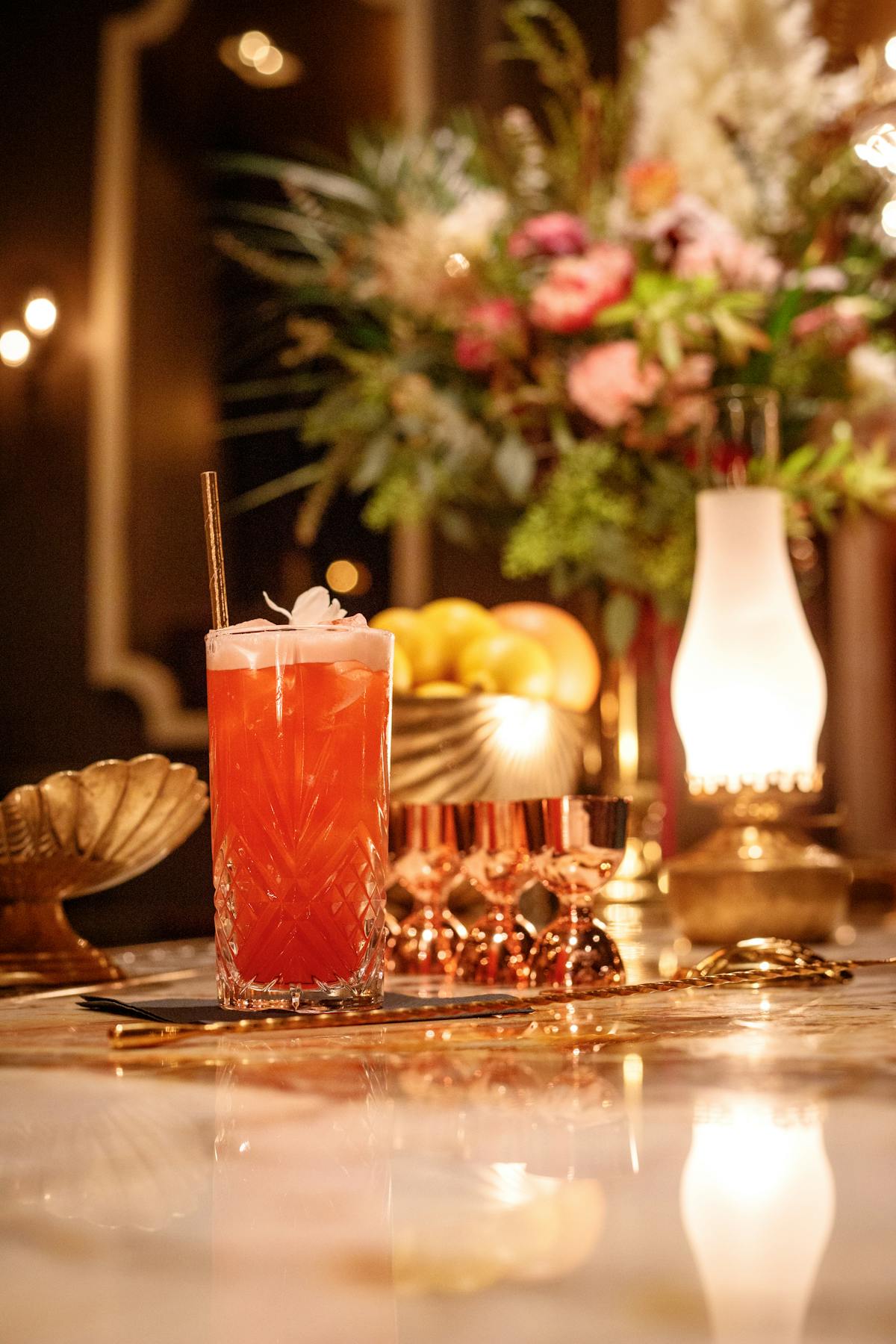 a tall glass vase on a table