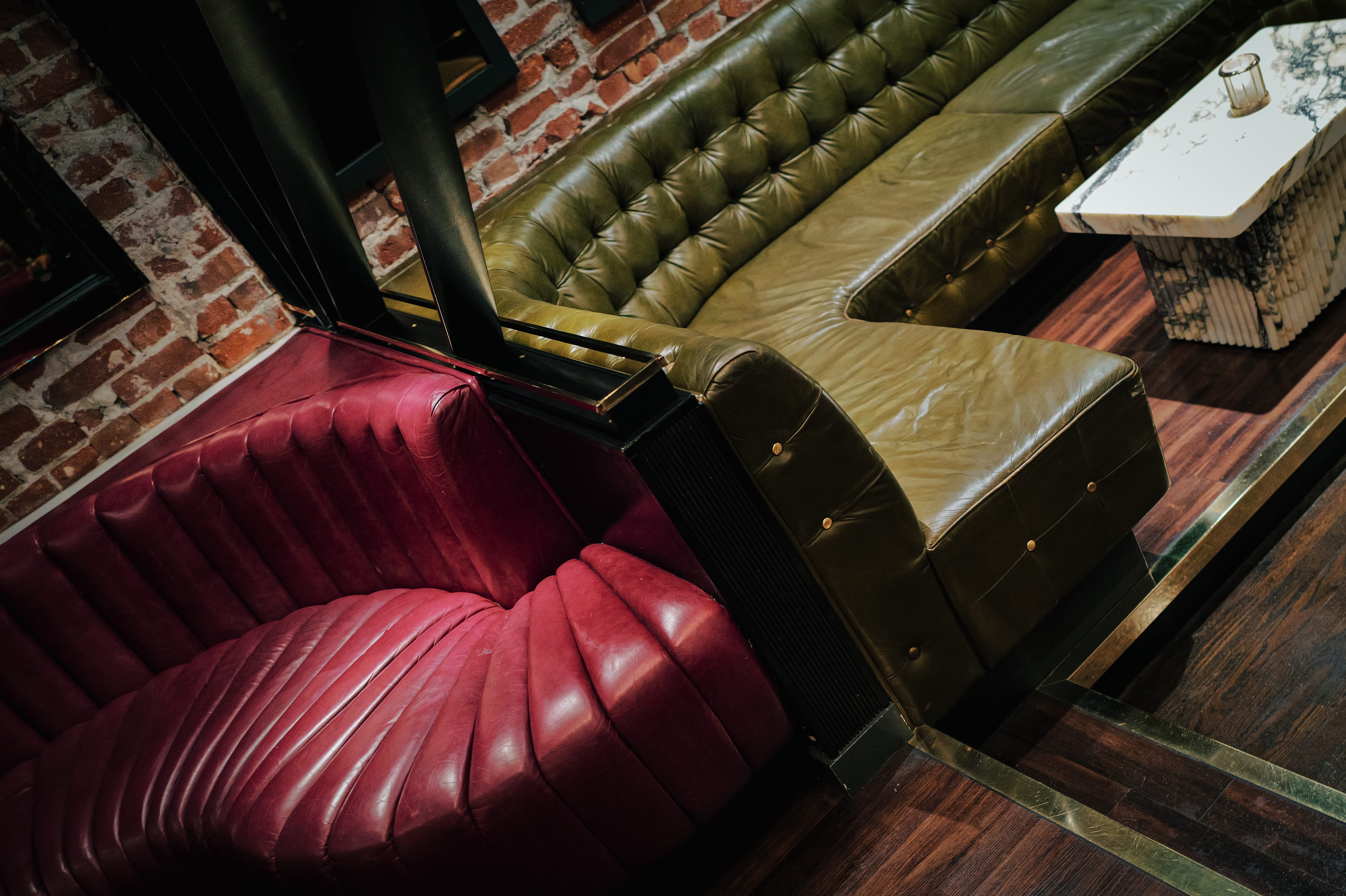 a person sitting on a leather couch