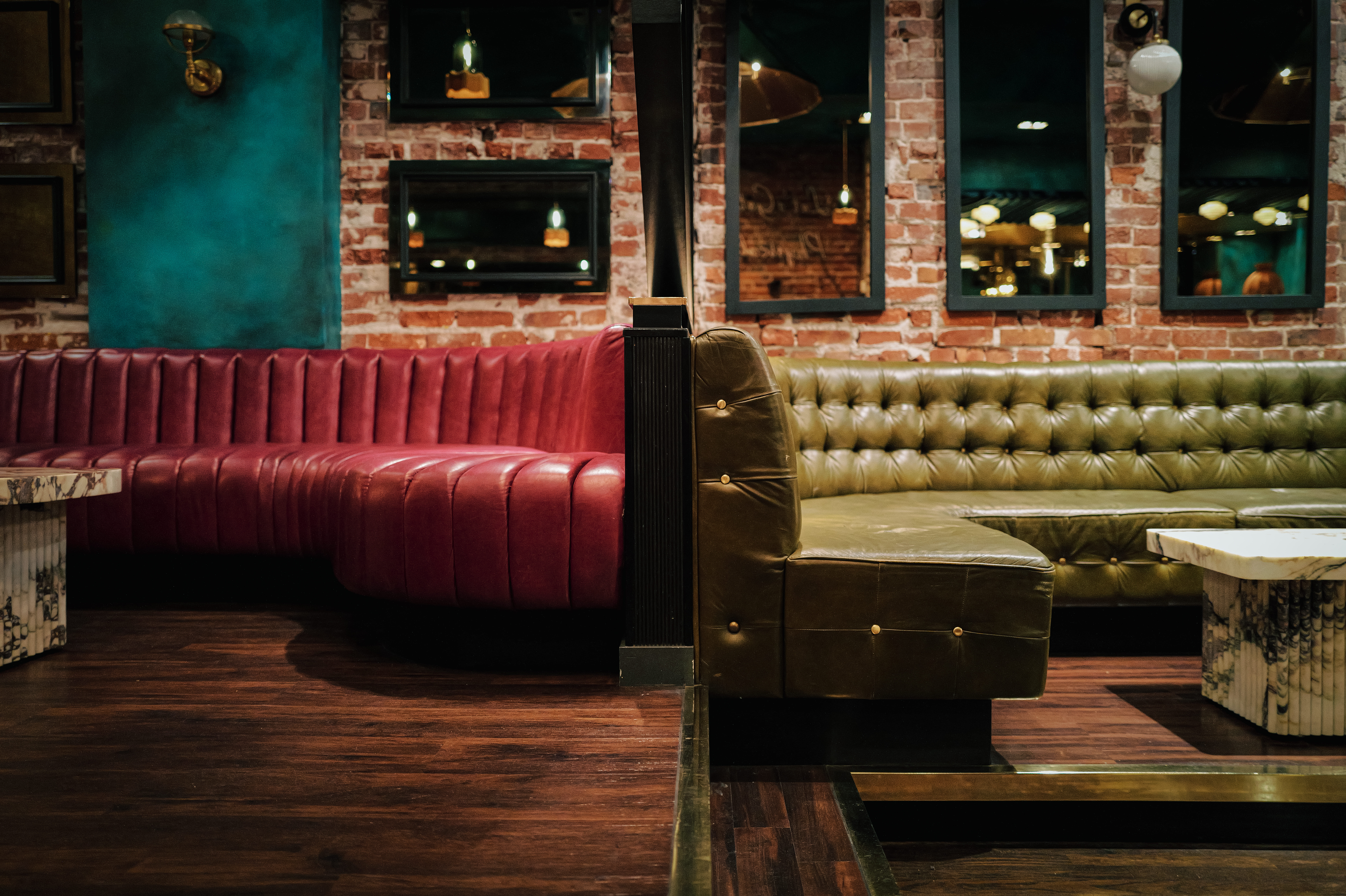 a room with a couch and a table in front of a building