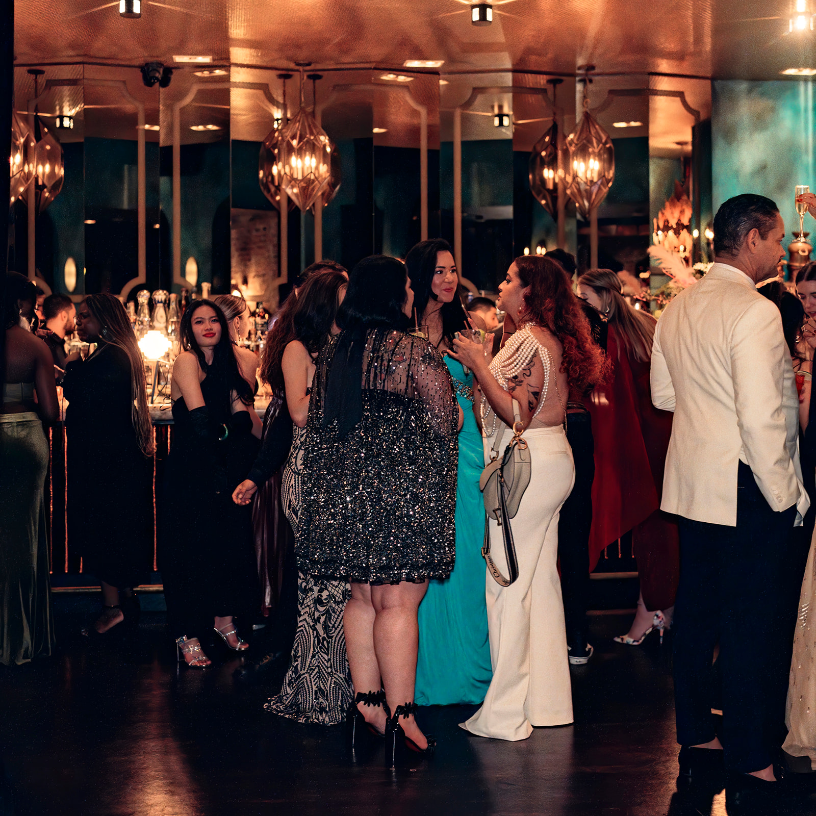 a group of people standing in front of a crowd posing for the camera