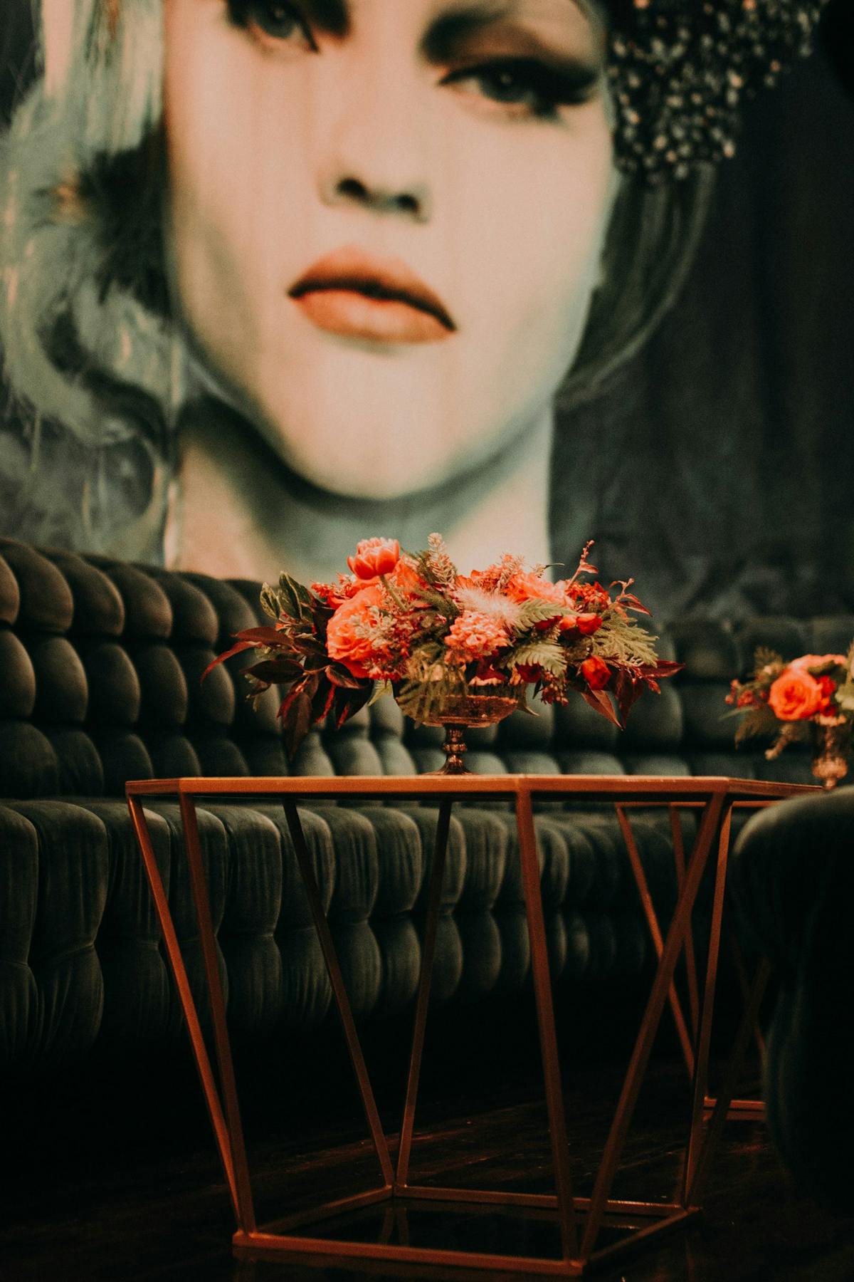 a woman standing in front of a flower