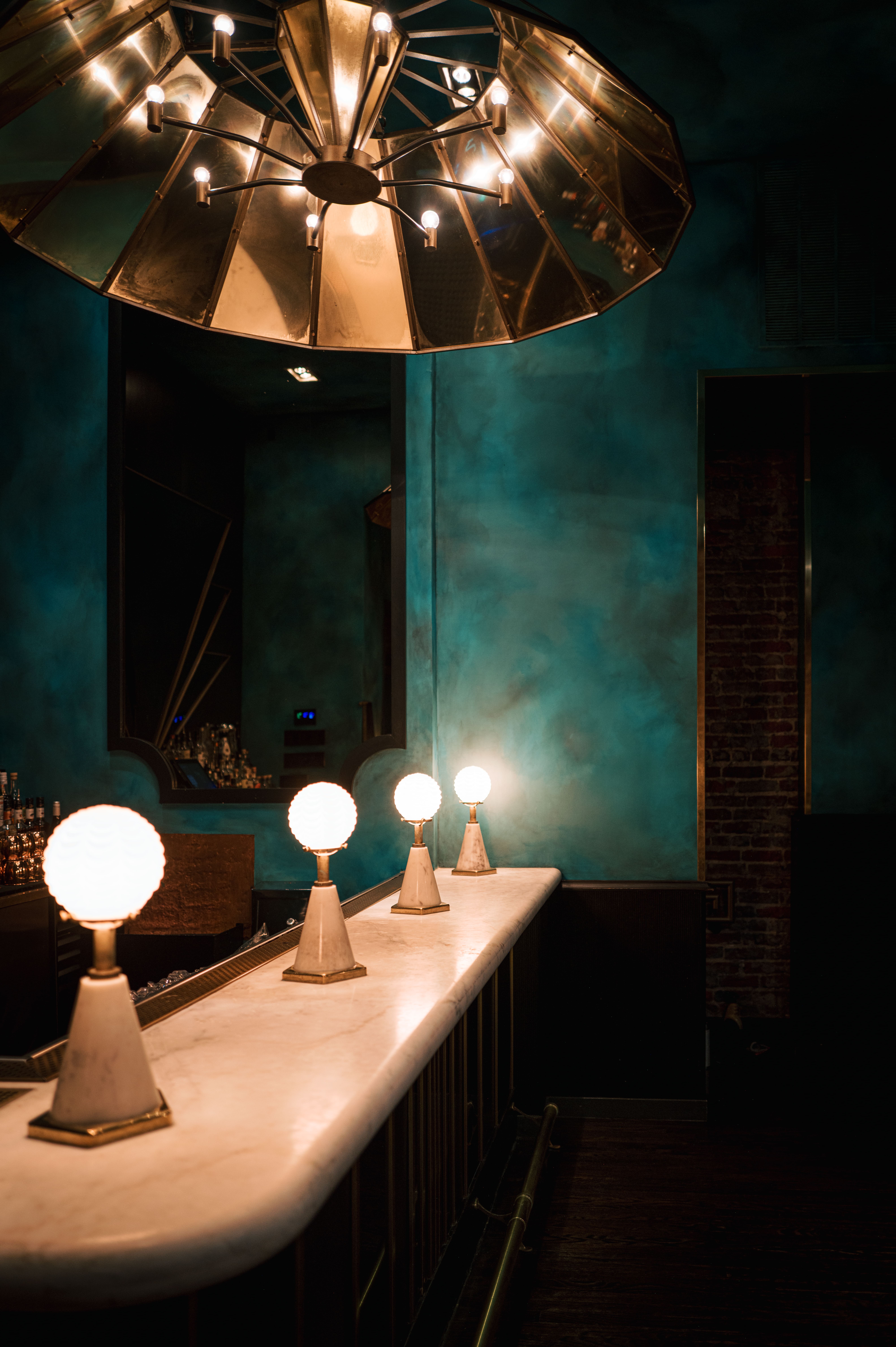 a glass with a blue light in a dark room