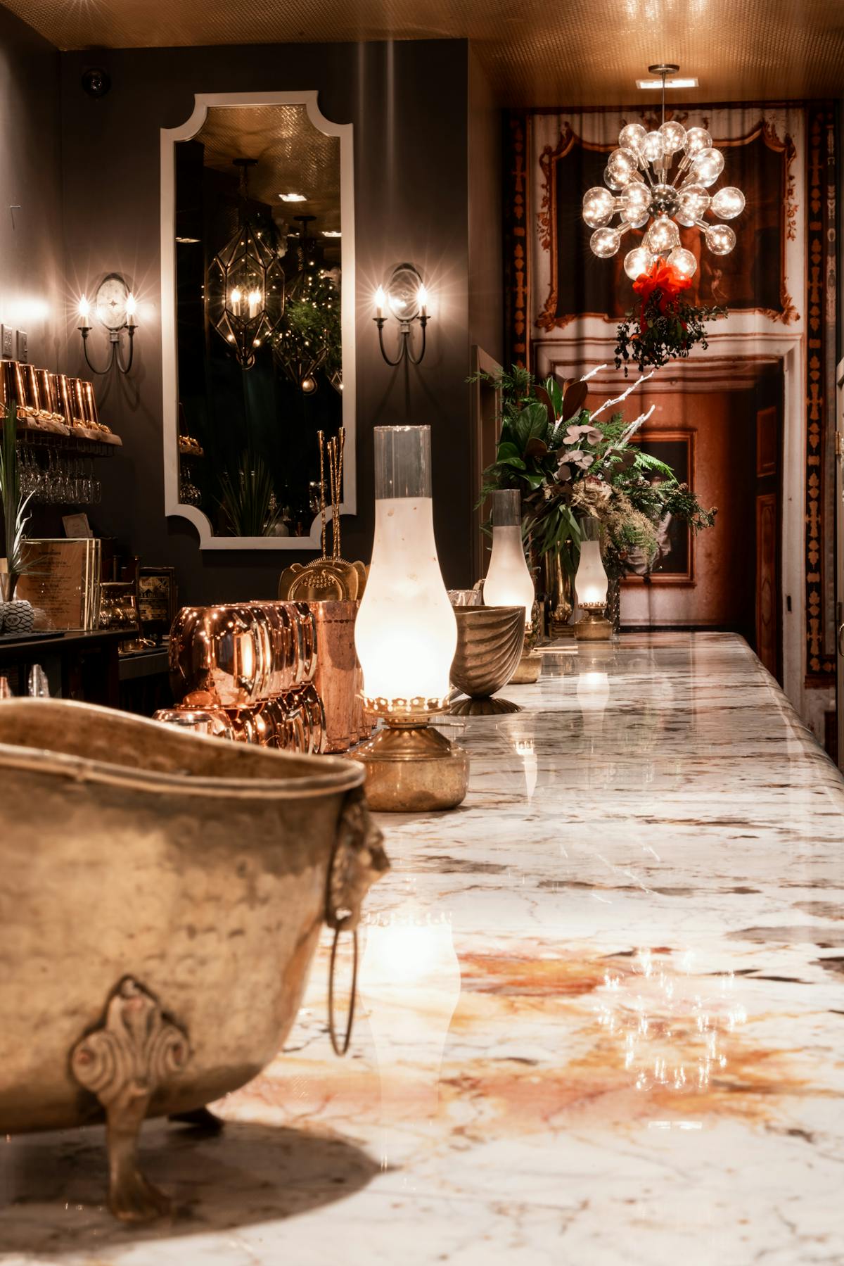 a room filled with furniture and vase of flowers on a table