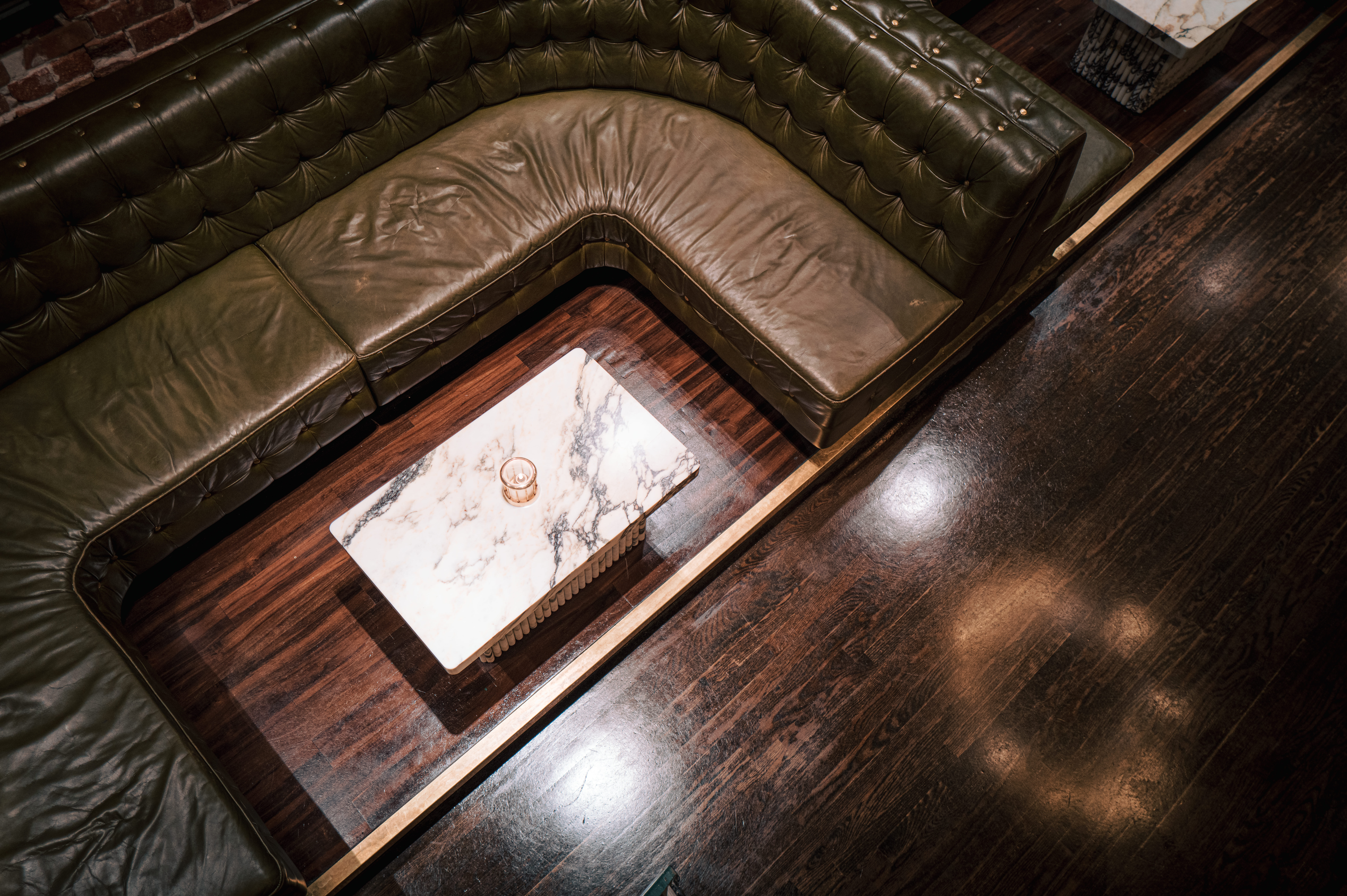 a clock sitting on top of a wooden table