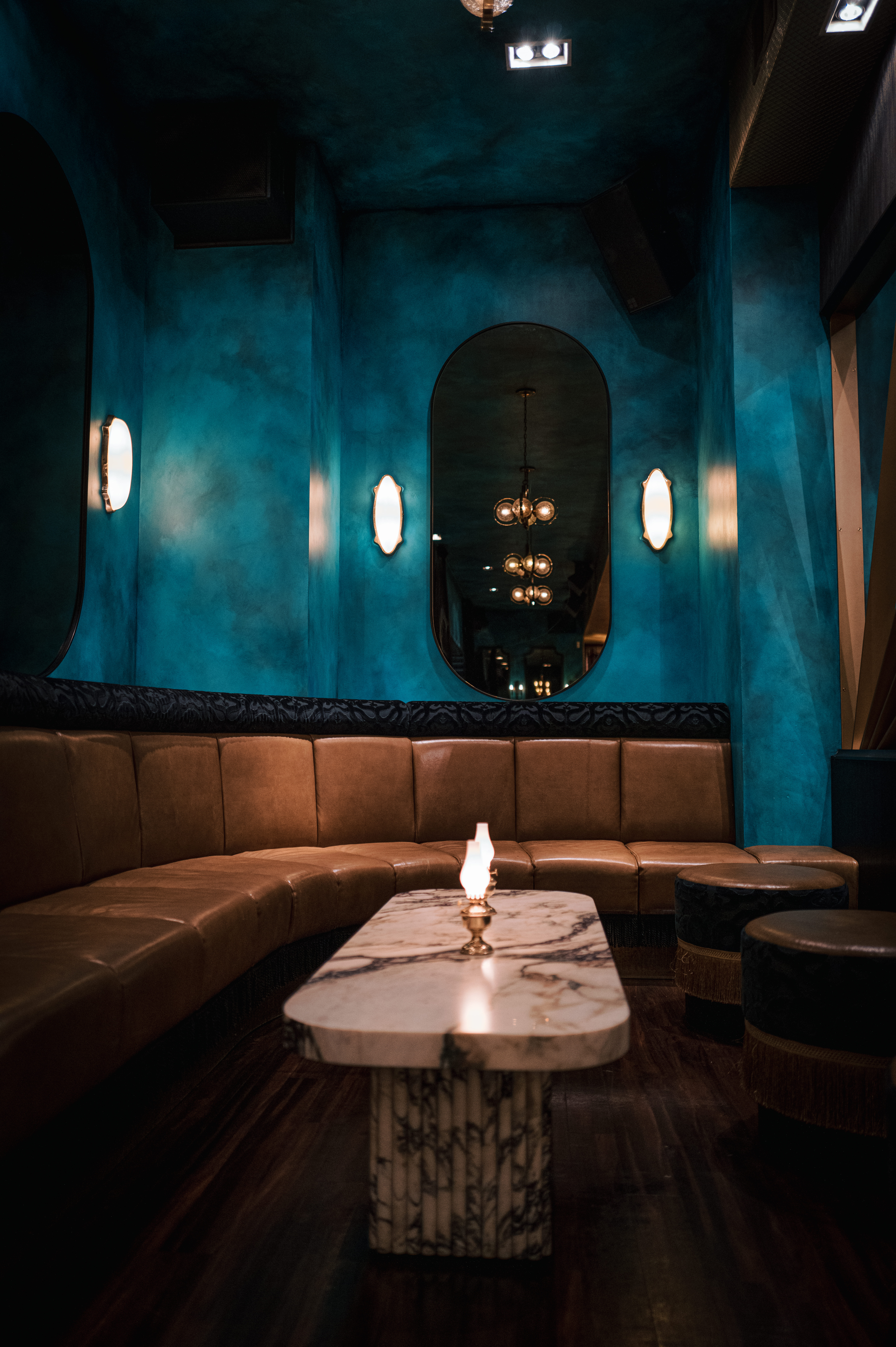 a glass with a blue light in a room