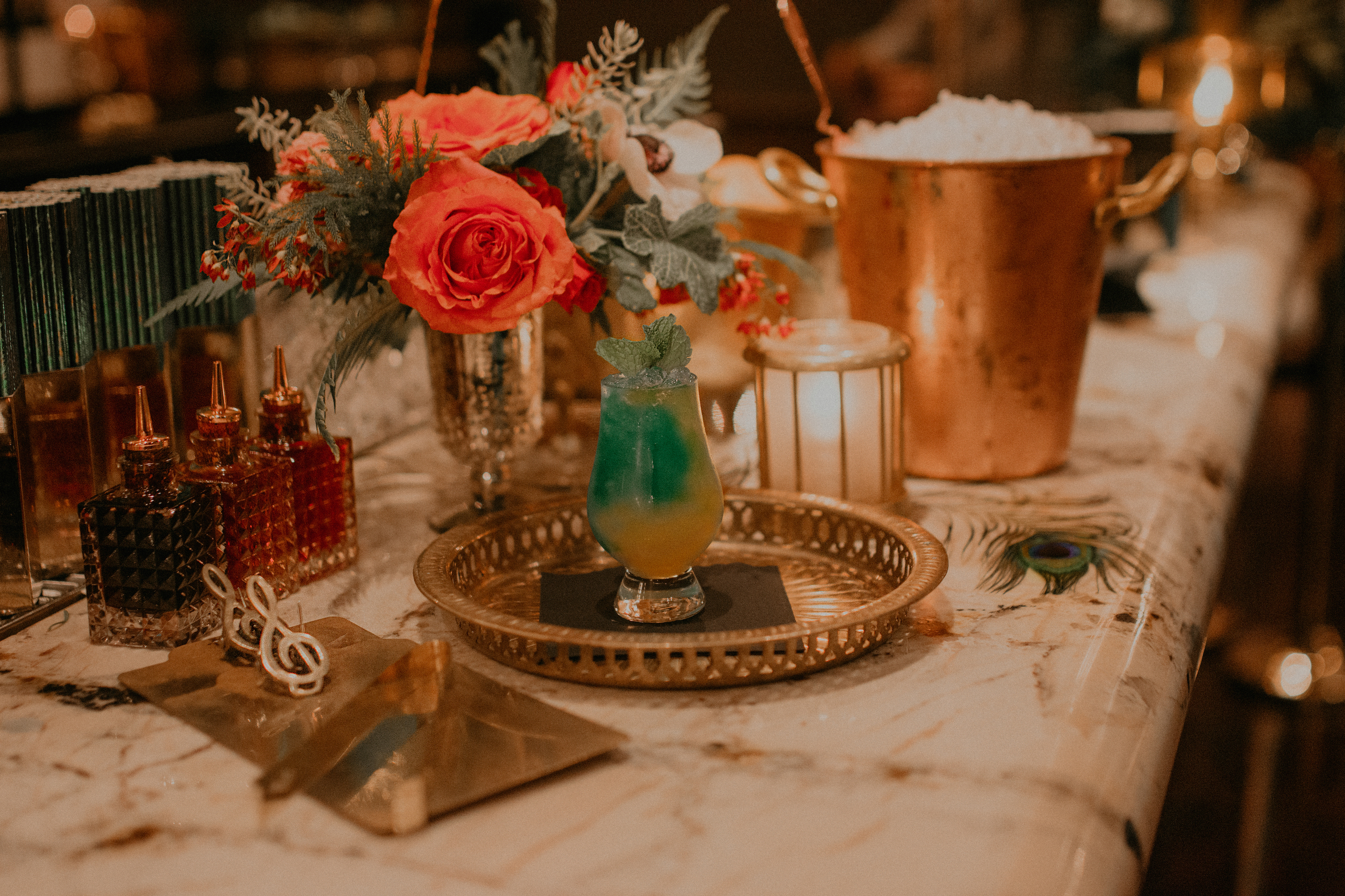 a cup with a flower on a table