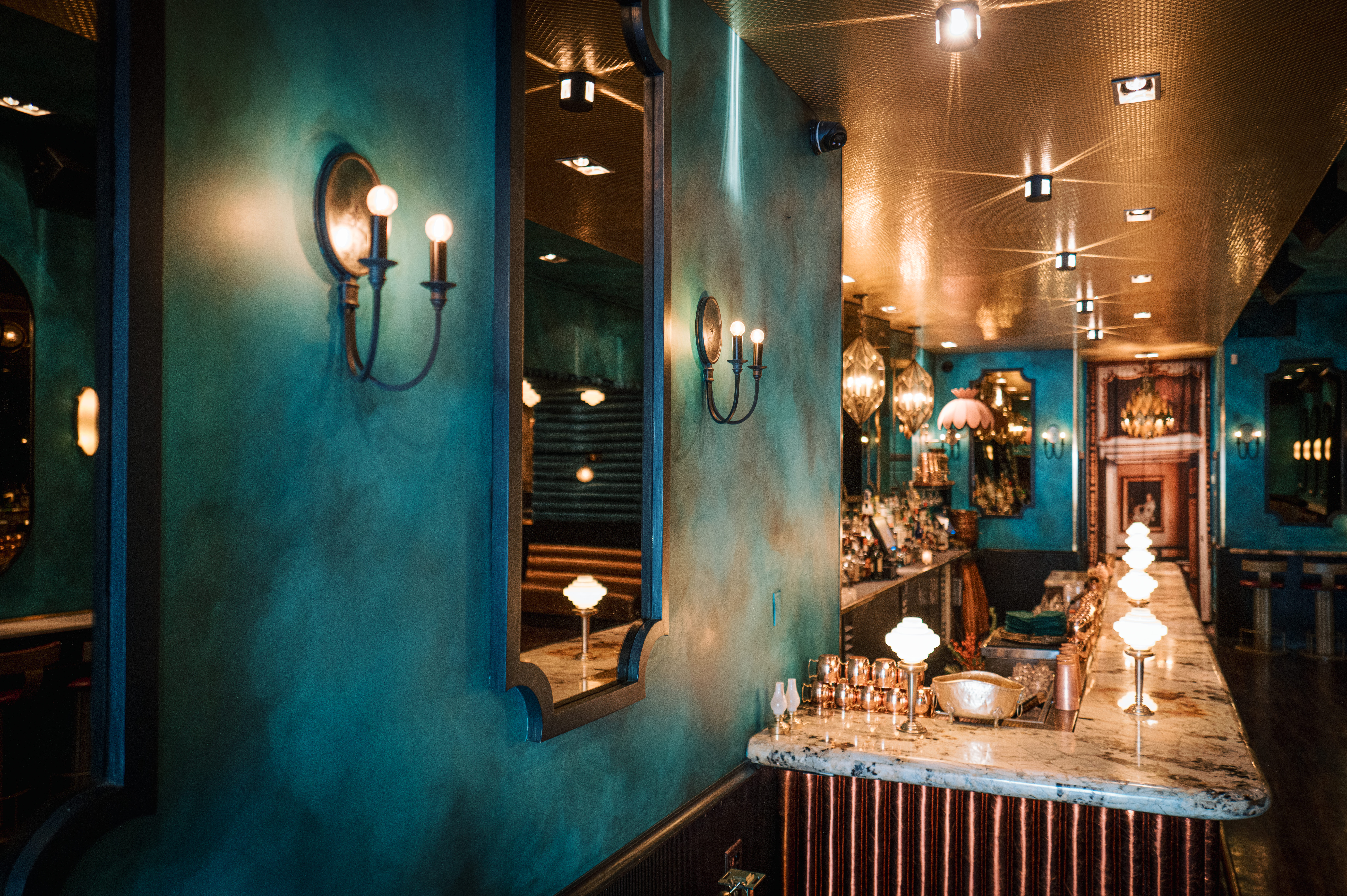 a room with a sink and a mirror