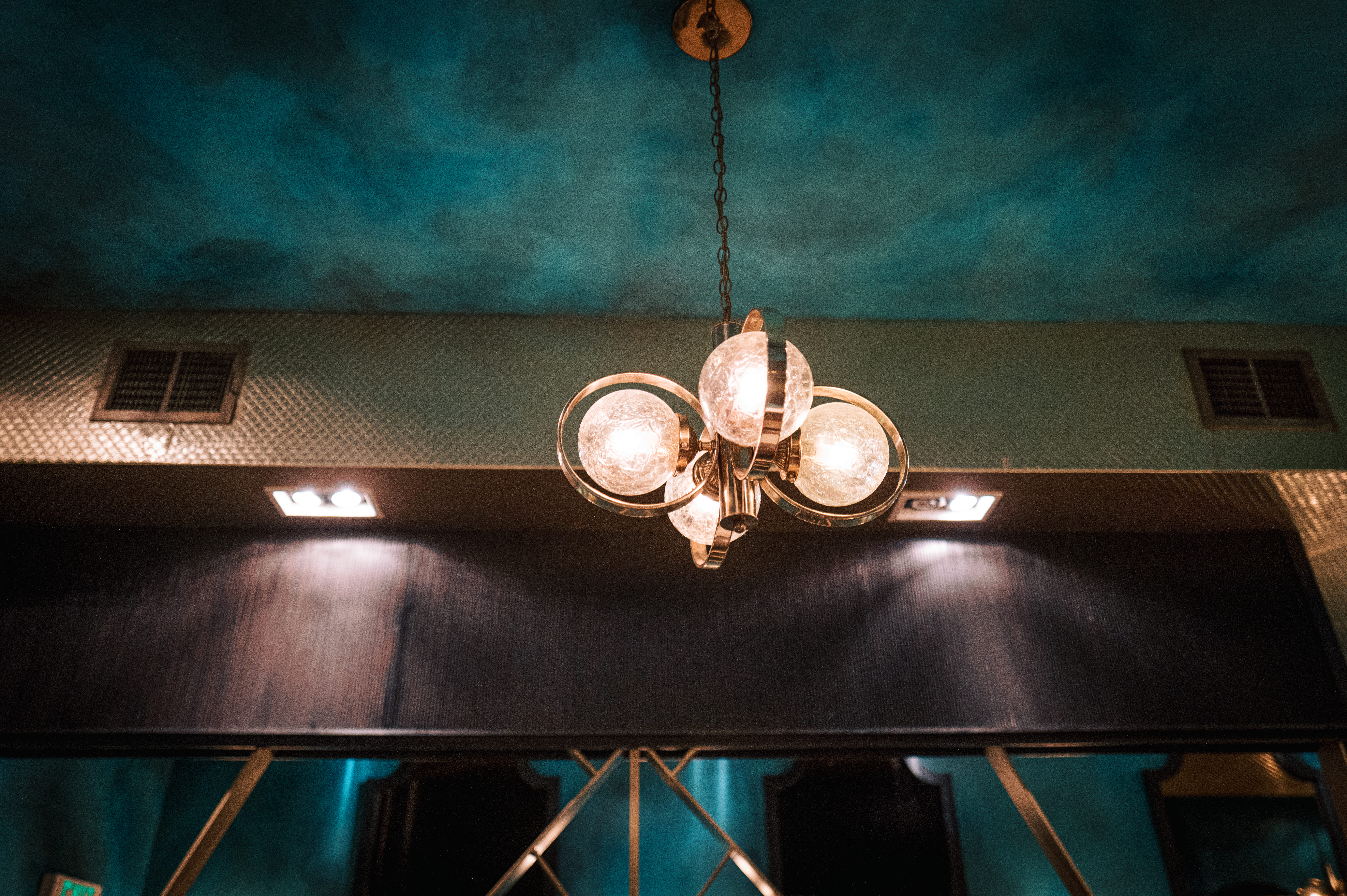 a clock sitting on top of a wooden table