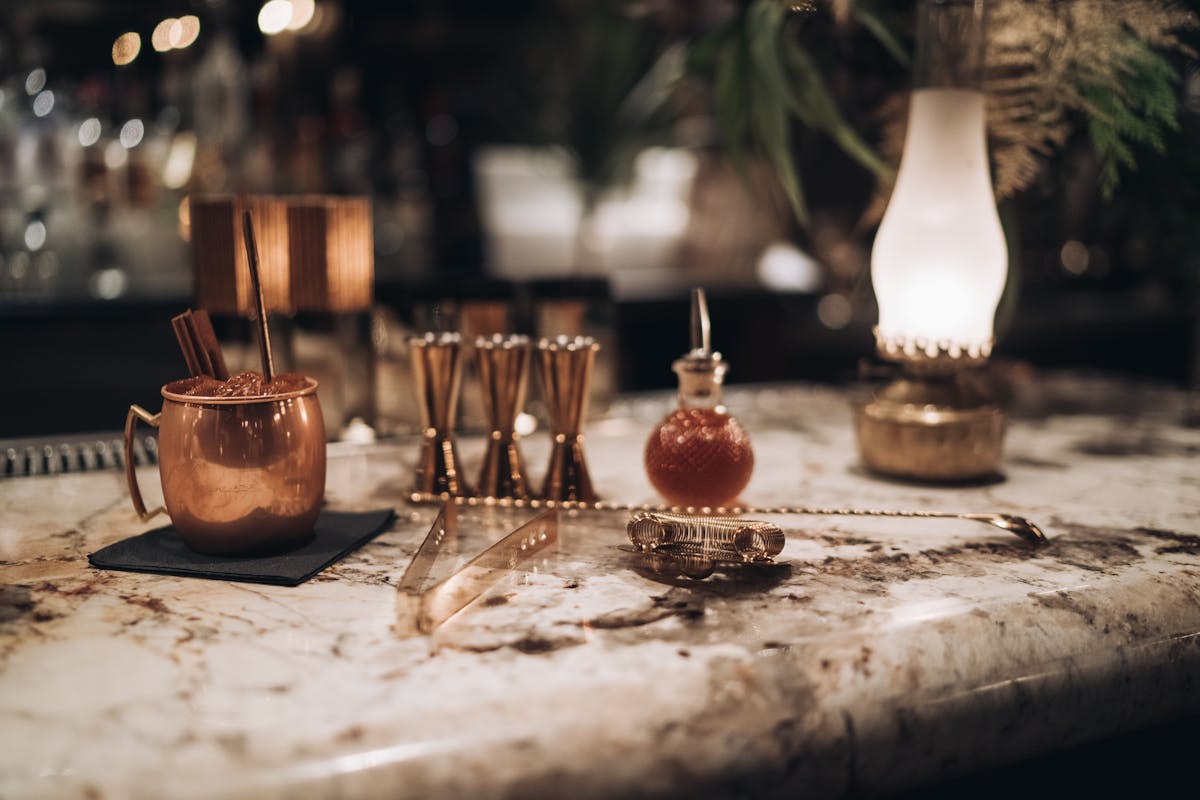 a table topped with glasses of wine