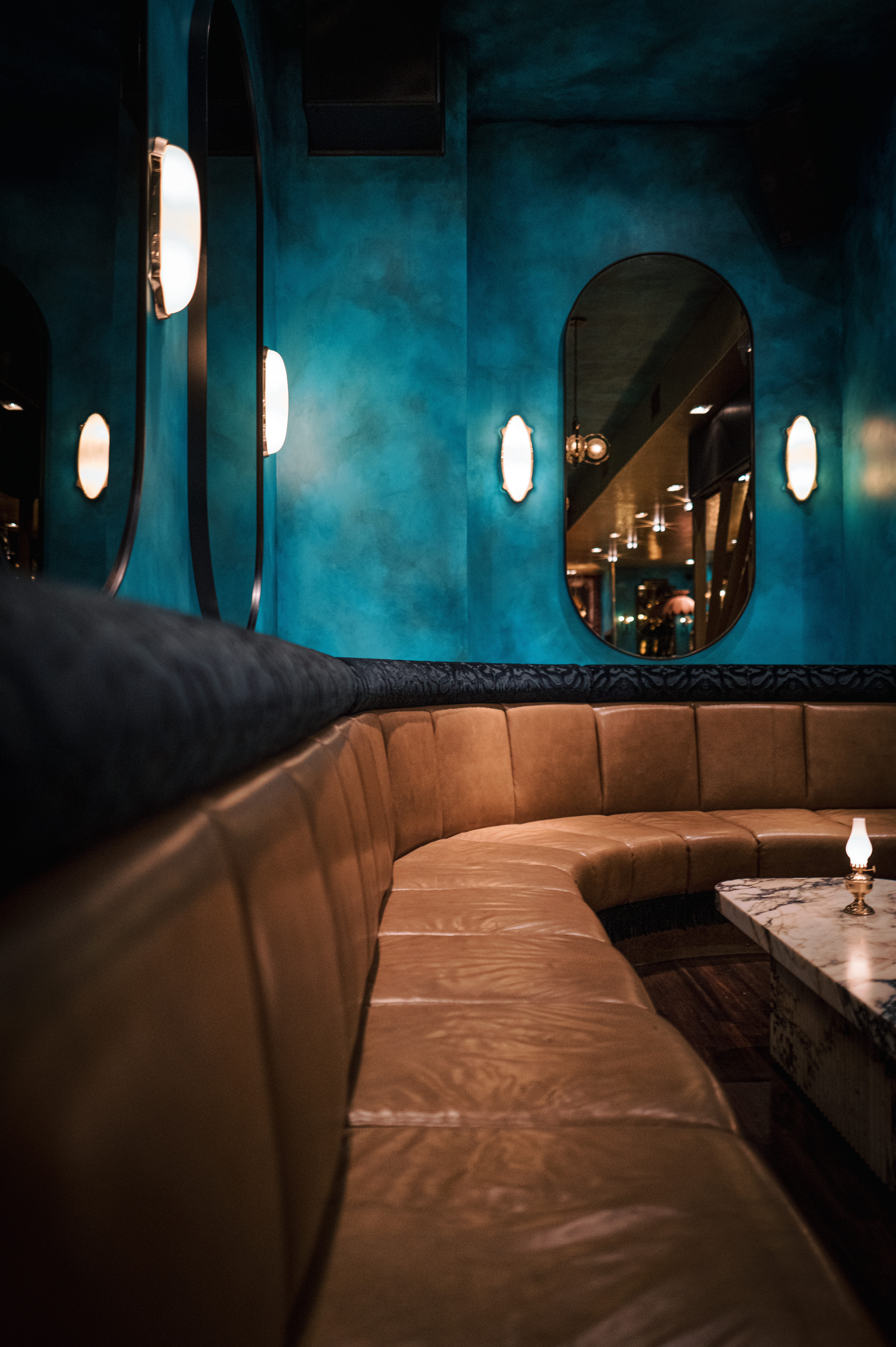 a person sitting in front of a mirror posing for the camera