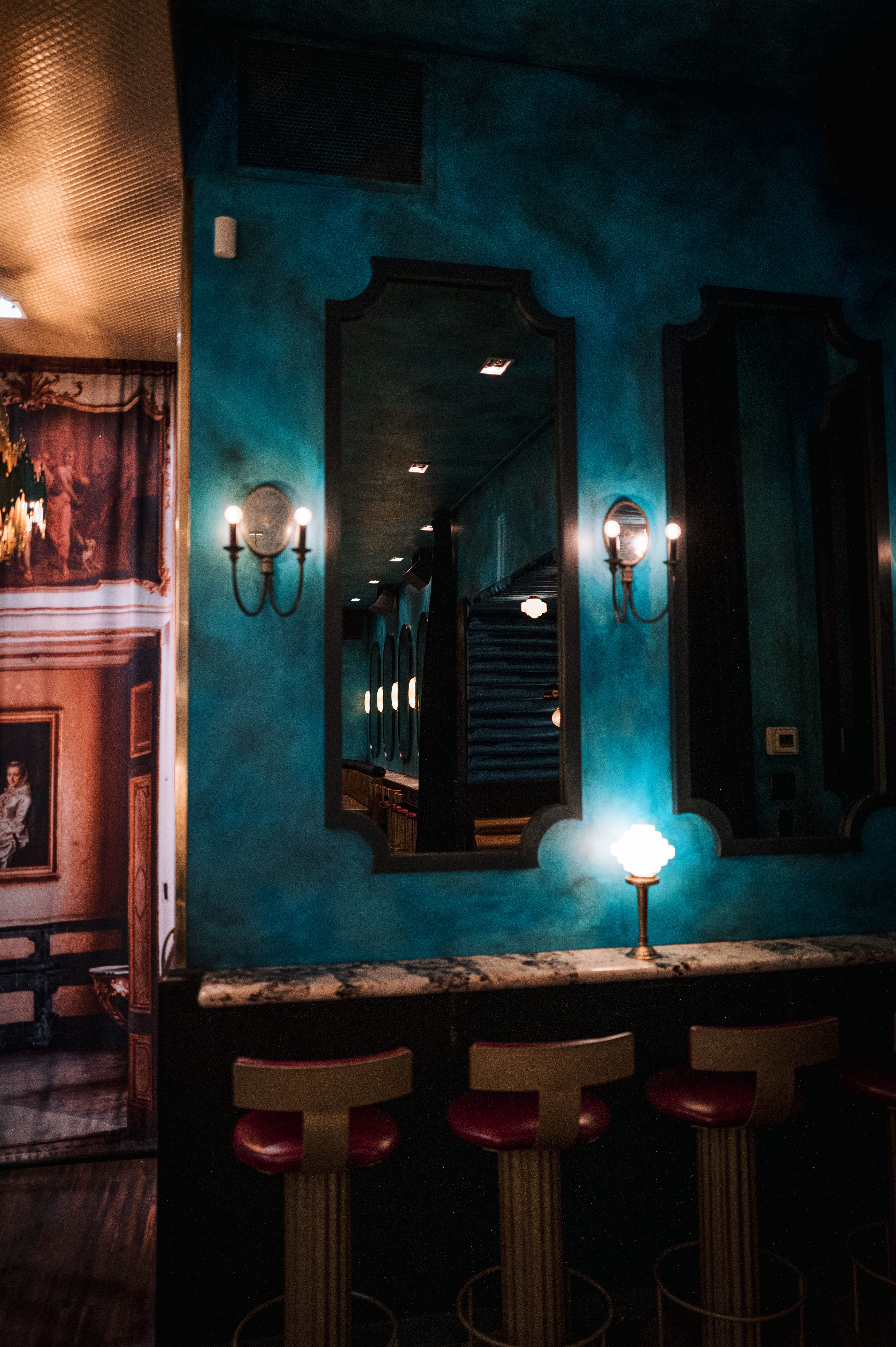 a room with a sink and a mirror