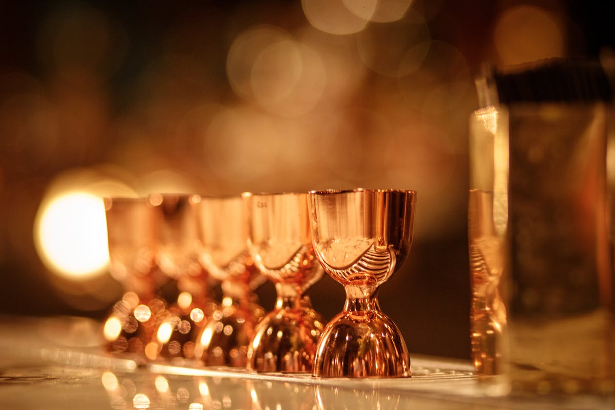 a close up of a bottle and a glass of wine
