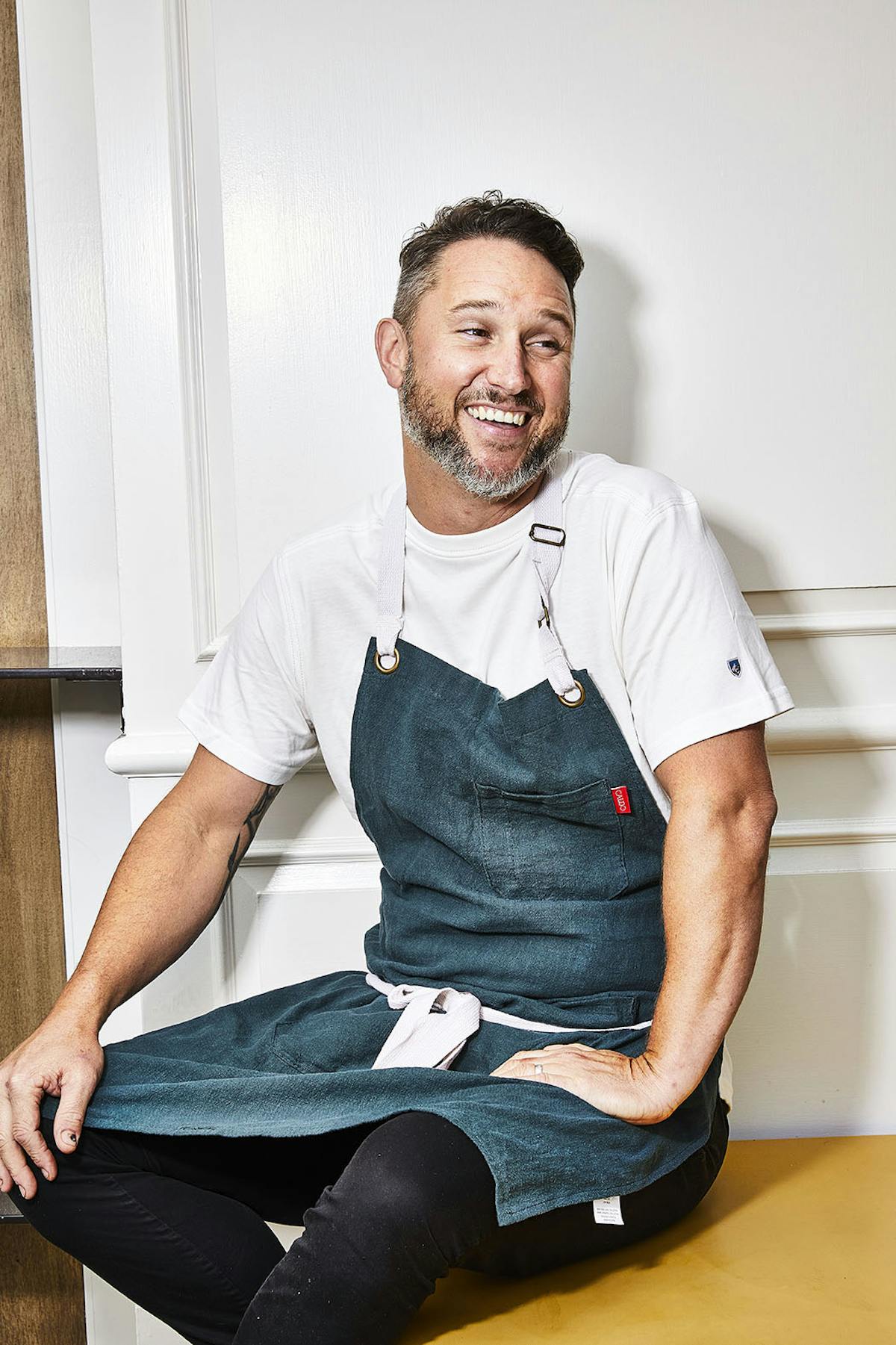 a man sitting in a chair laughing