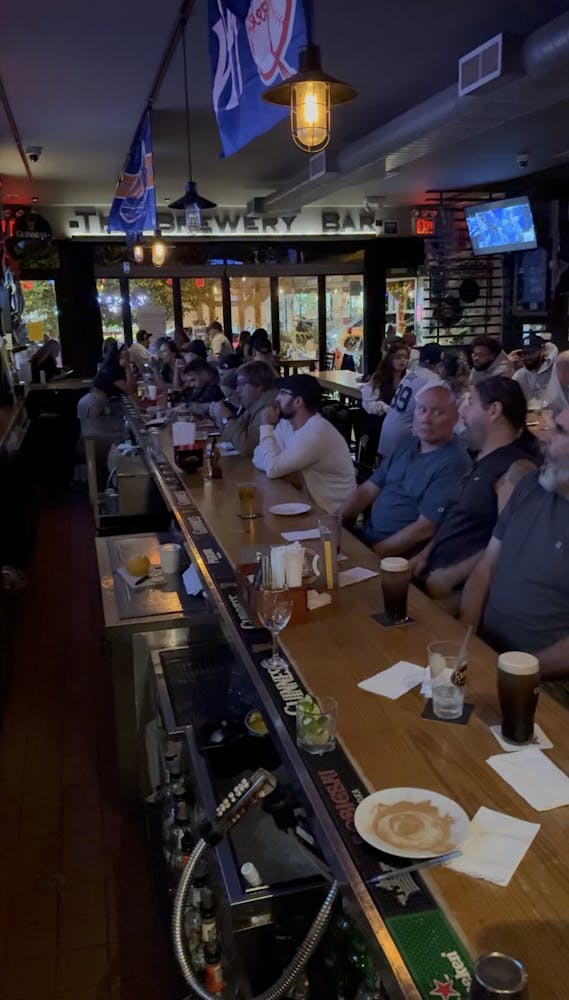 a group of people sitting at a table in a restaurant