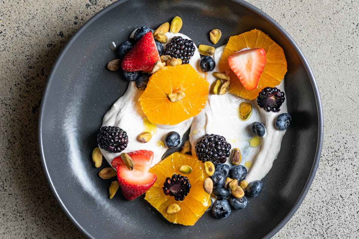 a bowl of fruit on a plate