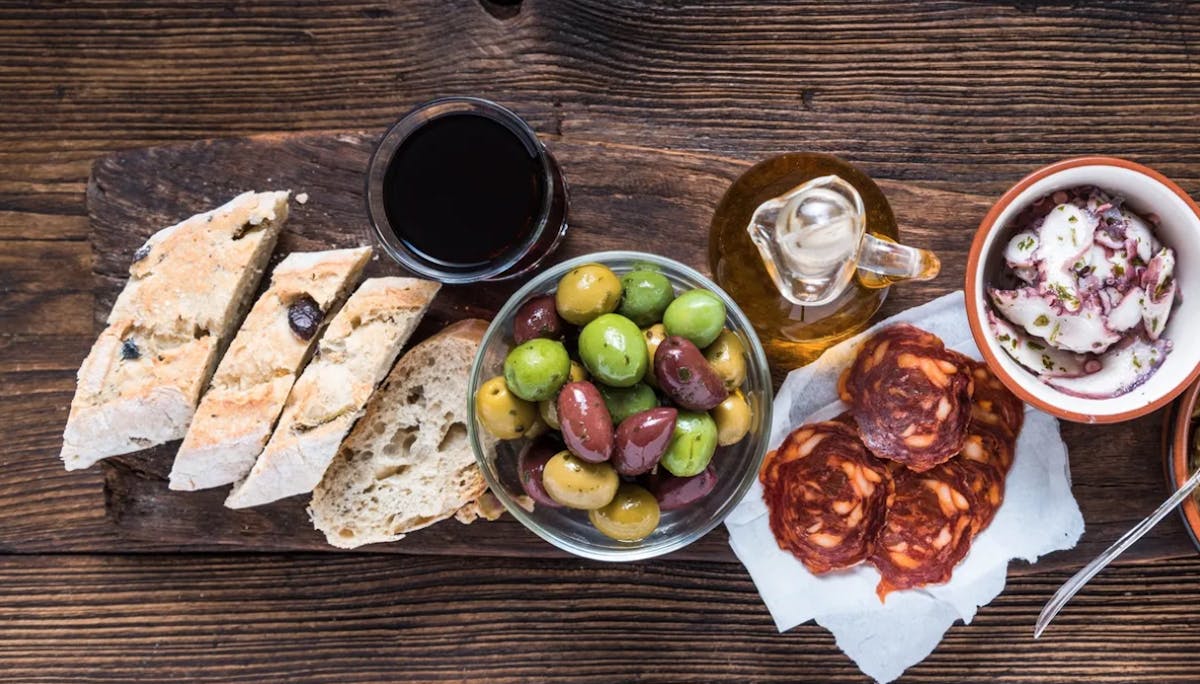 a bunch of food sitting on top of a wooden table