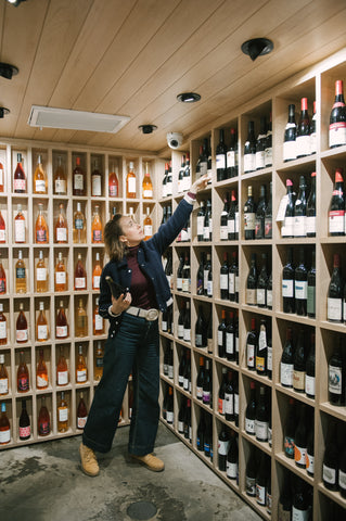 a person standing in front of a store