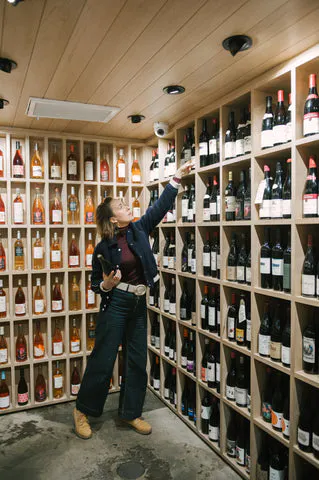 a person standing in front of a store