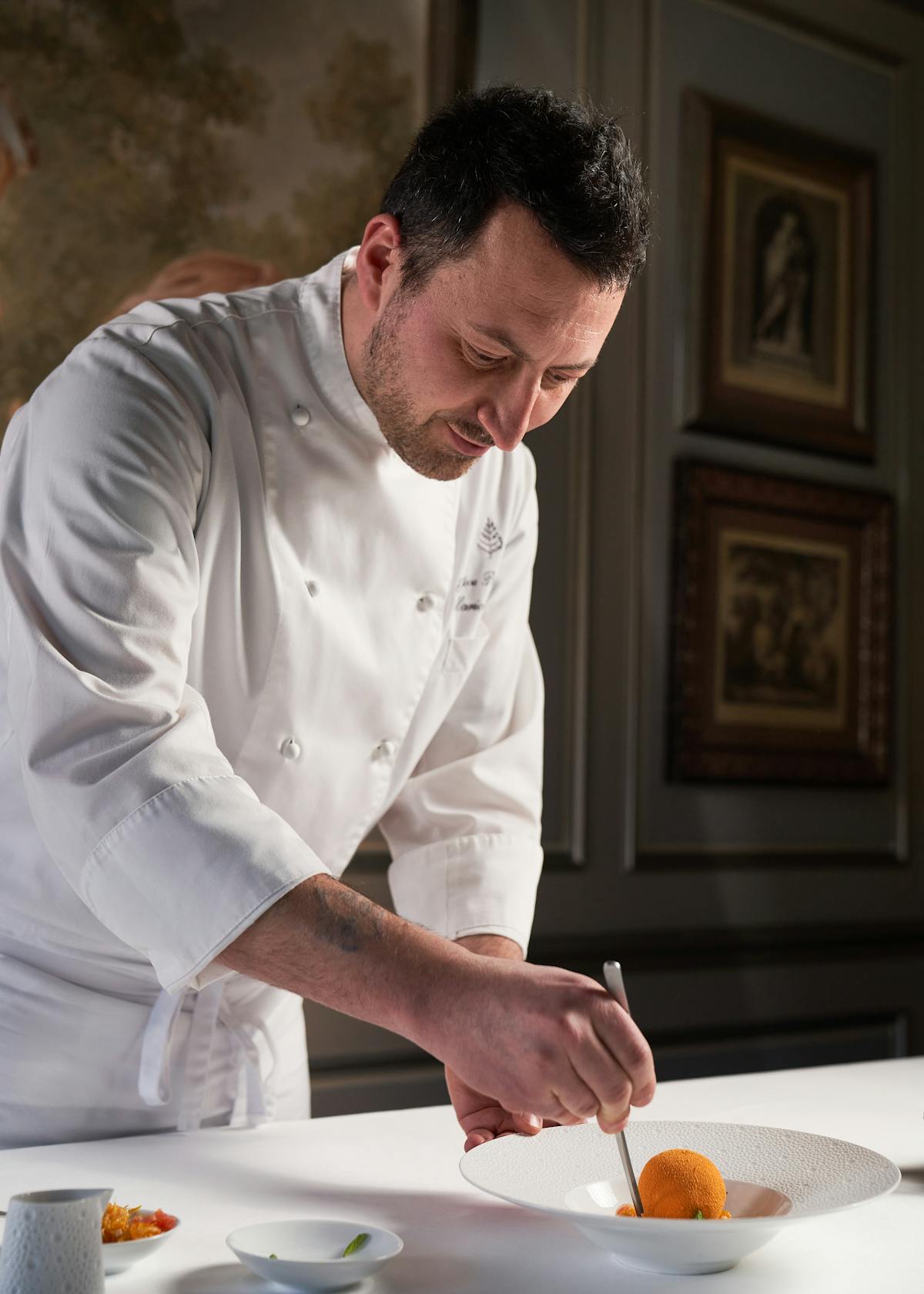 a man cutting food on a table