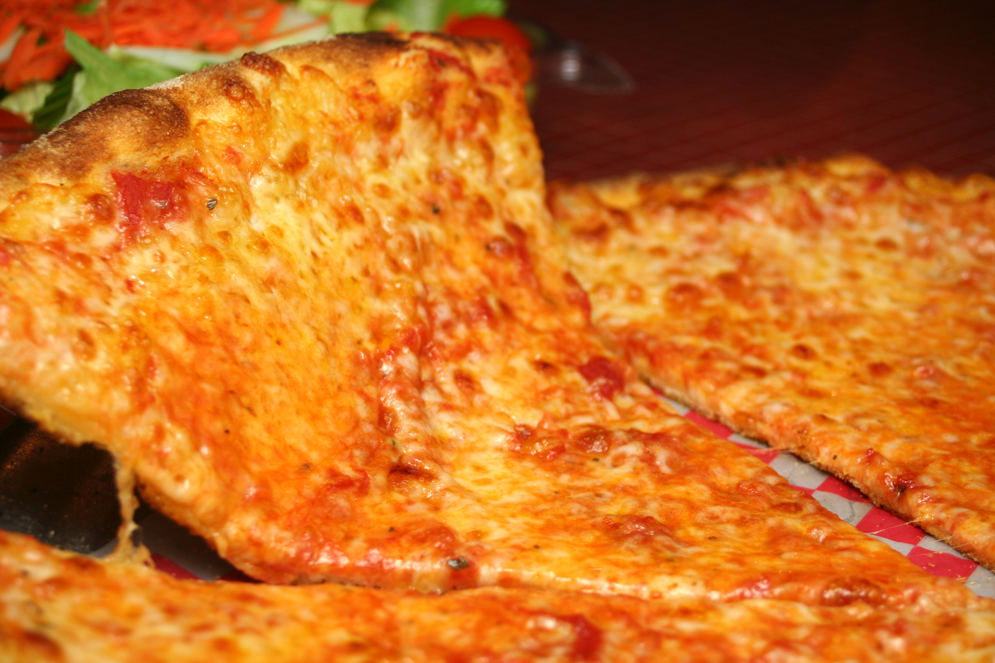 a close up of a slice of pizza