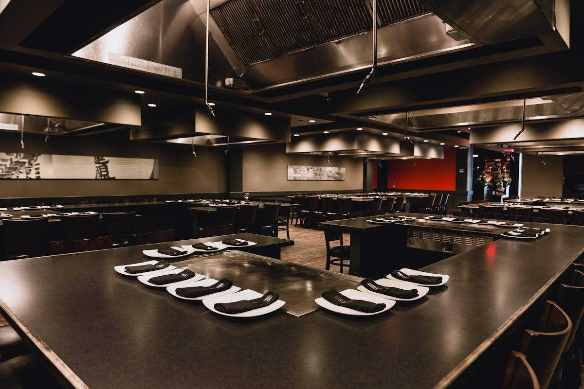 a kitchen with a table in a restaurant