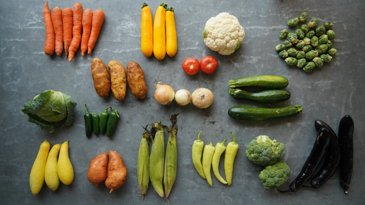 a bunch of different types of vegetables on a cutting board