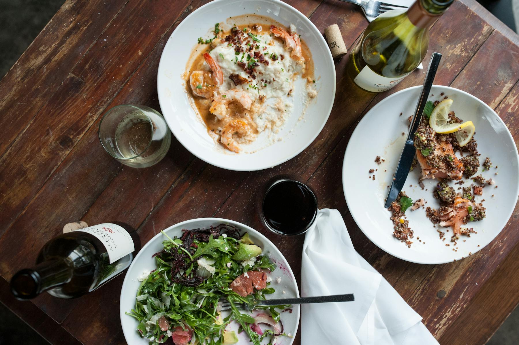 a plate of food sitting on top of a wooden table