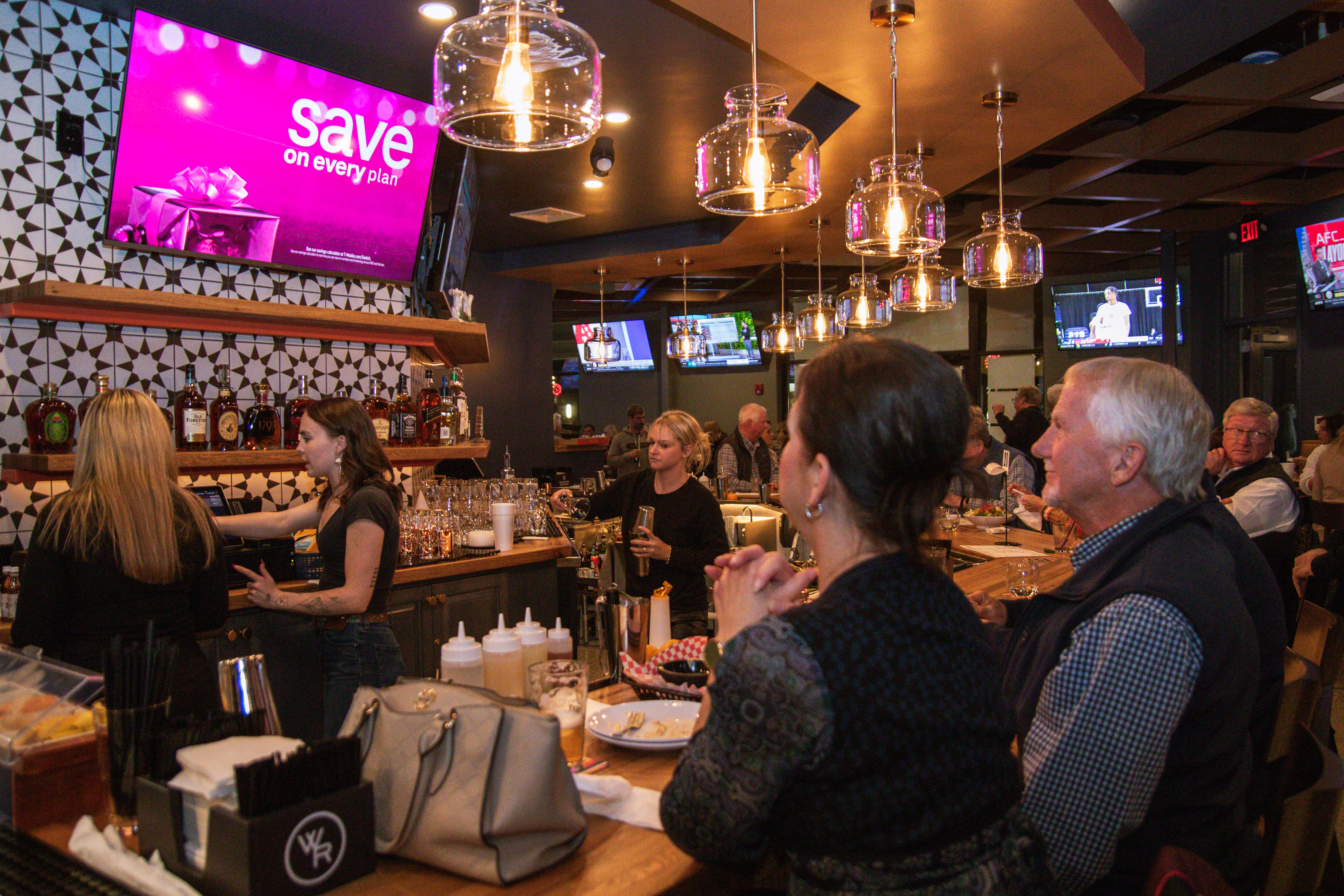 customers sat at bar