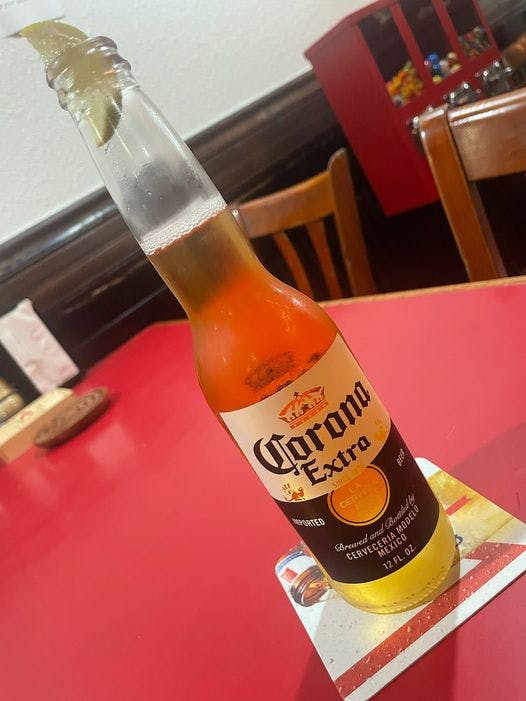 a bottle of beer on a table
