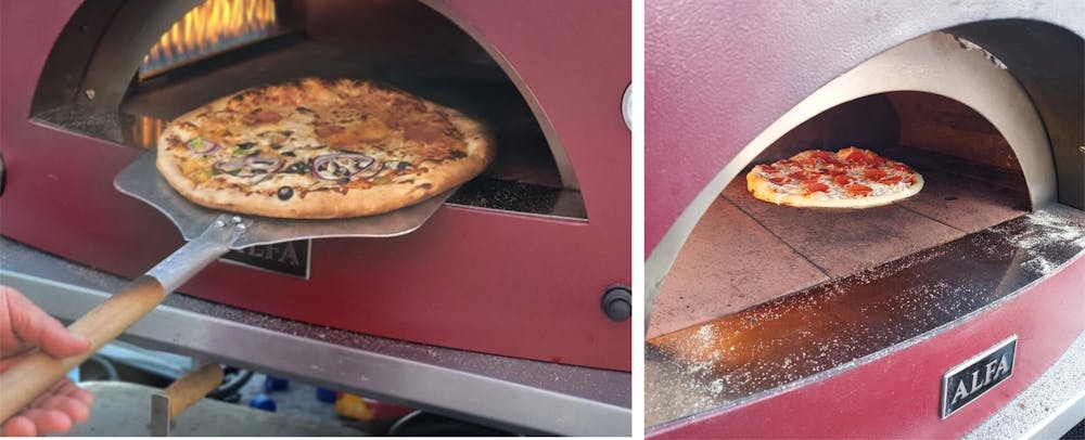 a pizza sitting on top of a stove
