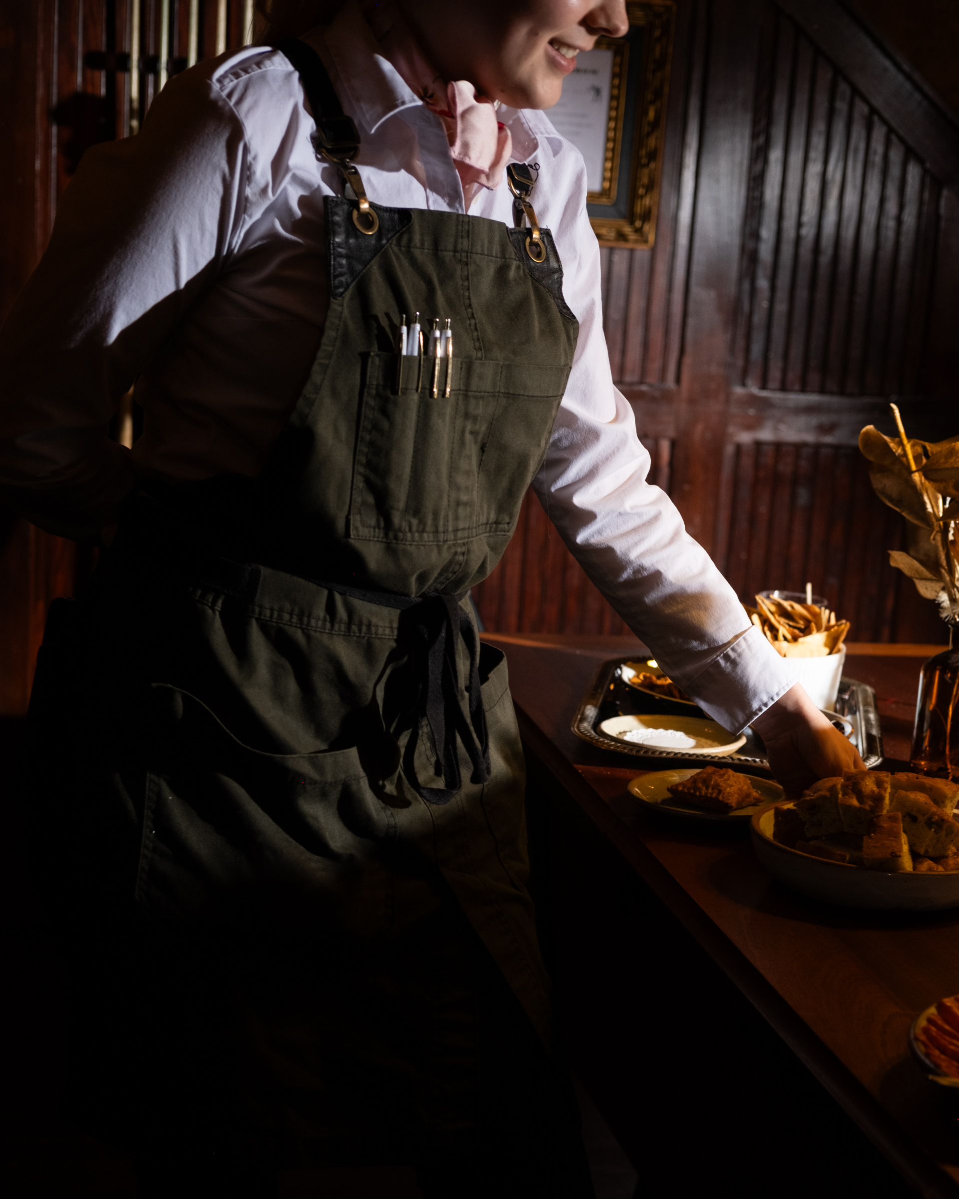 a person standing in front of a cake