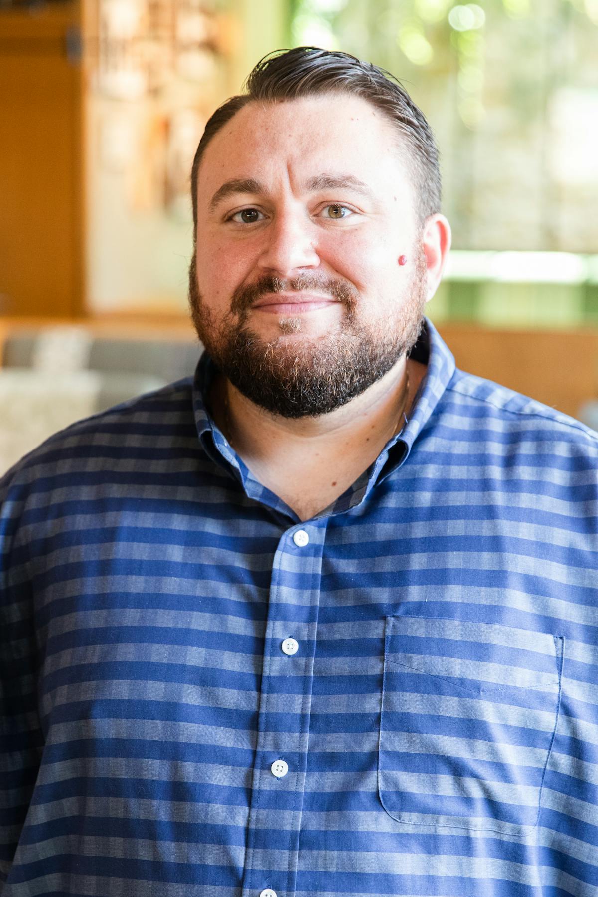 a man wearing a blue shirt