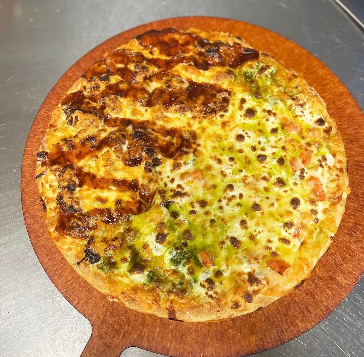 a pizza sitting on top of a pan on a table
