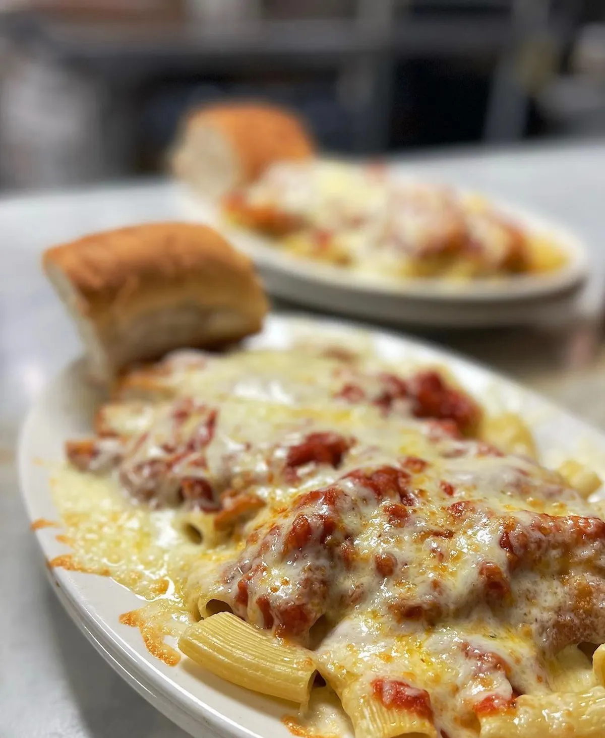 a close up of a plate of food with a slice of pizza