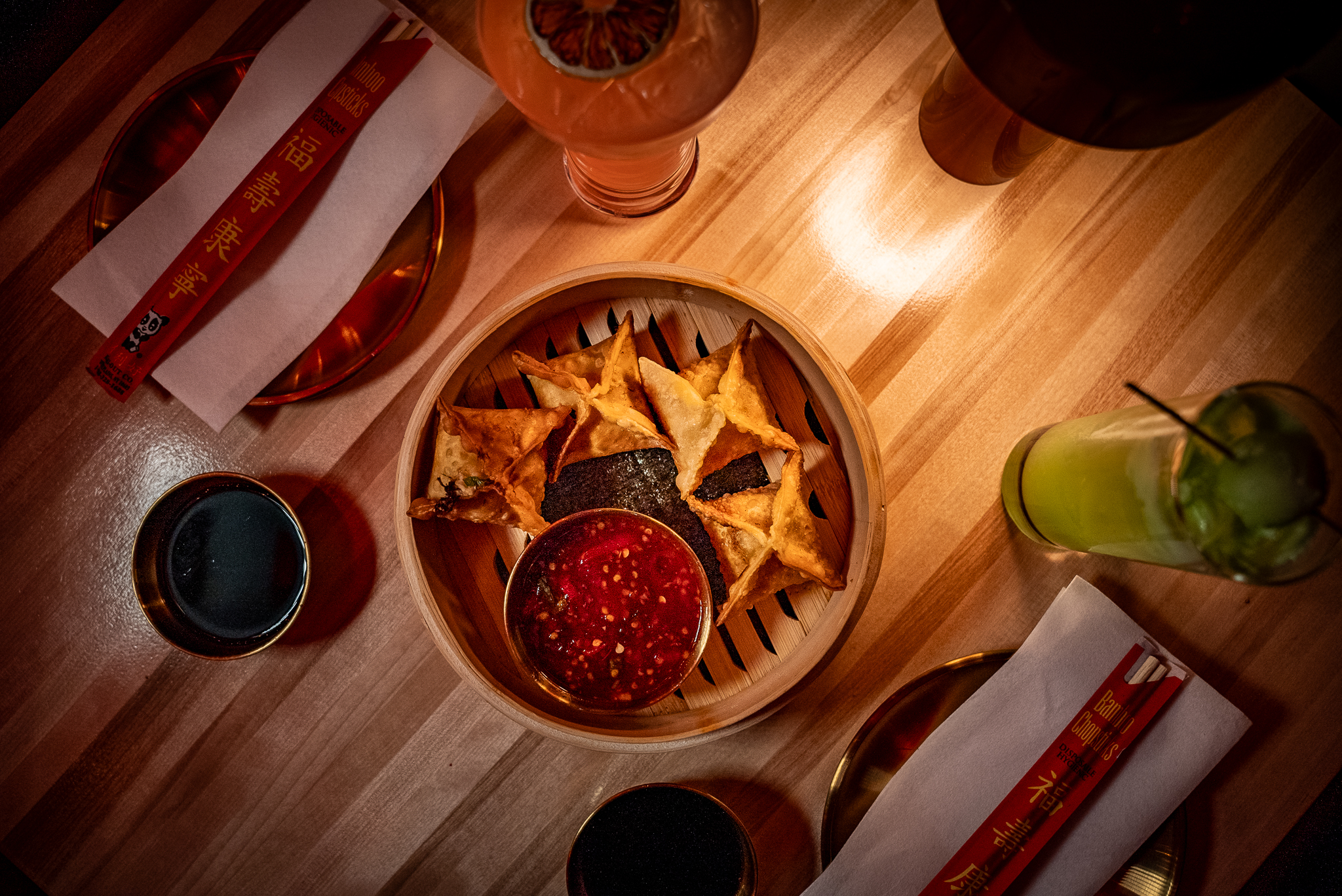 a bowl of food sitting on top of a wooden table