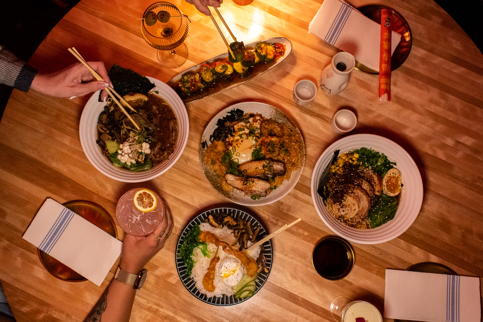a bunch of food sitting on top of a wooden table