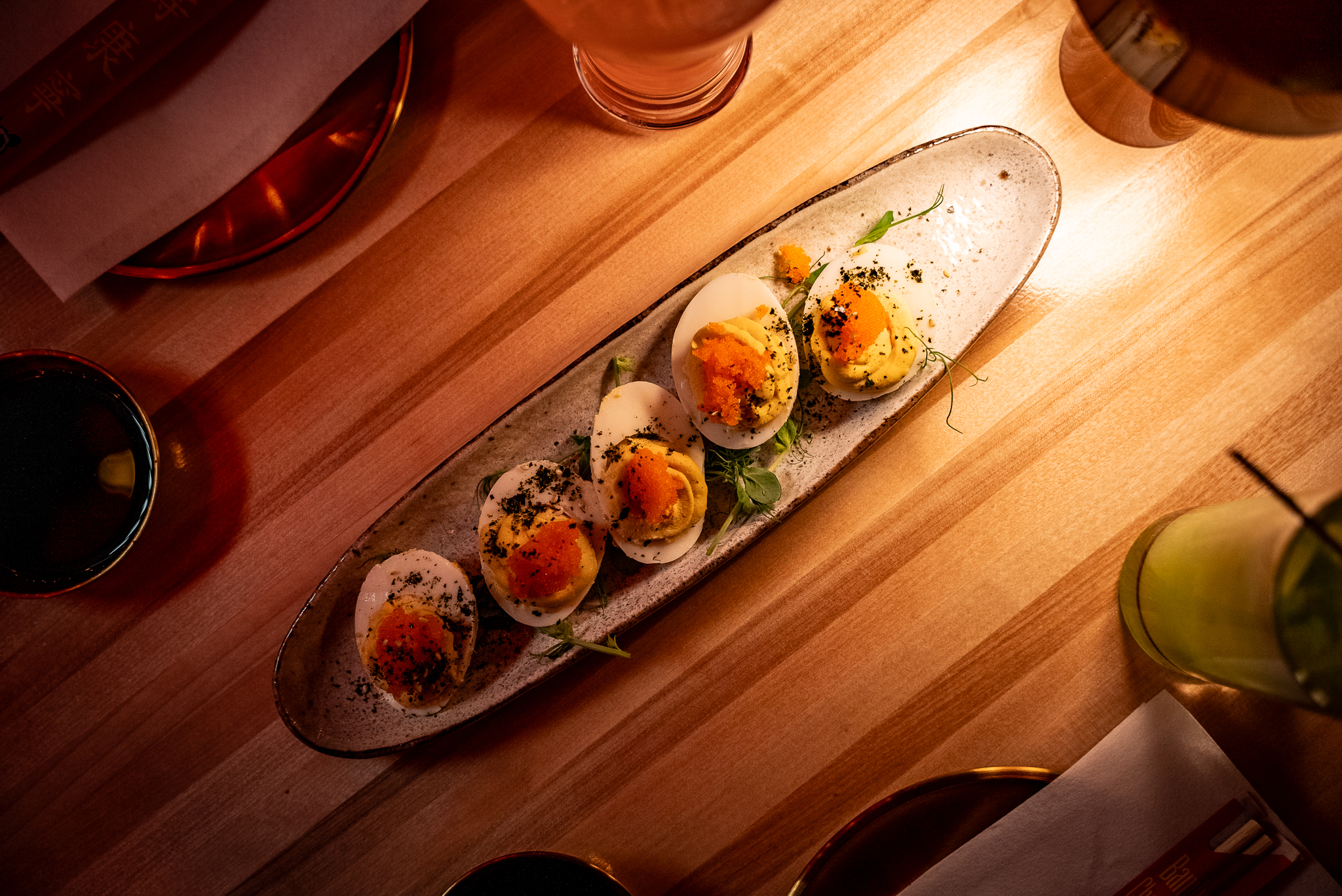 a plate of food sitting on top of a wooden table