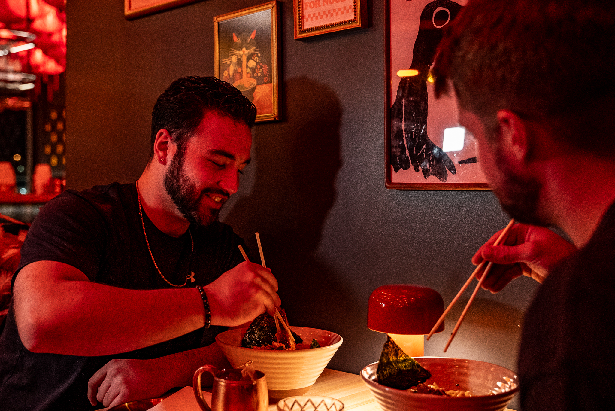 a man sitting at a table eating food