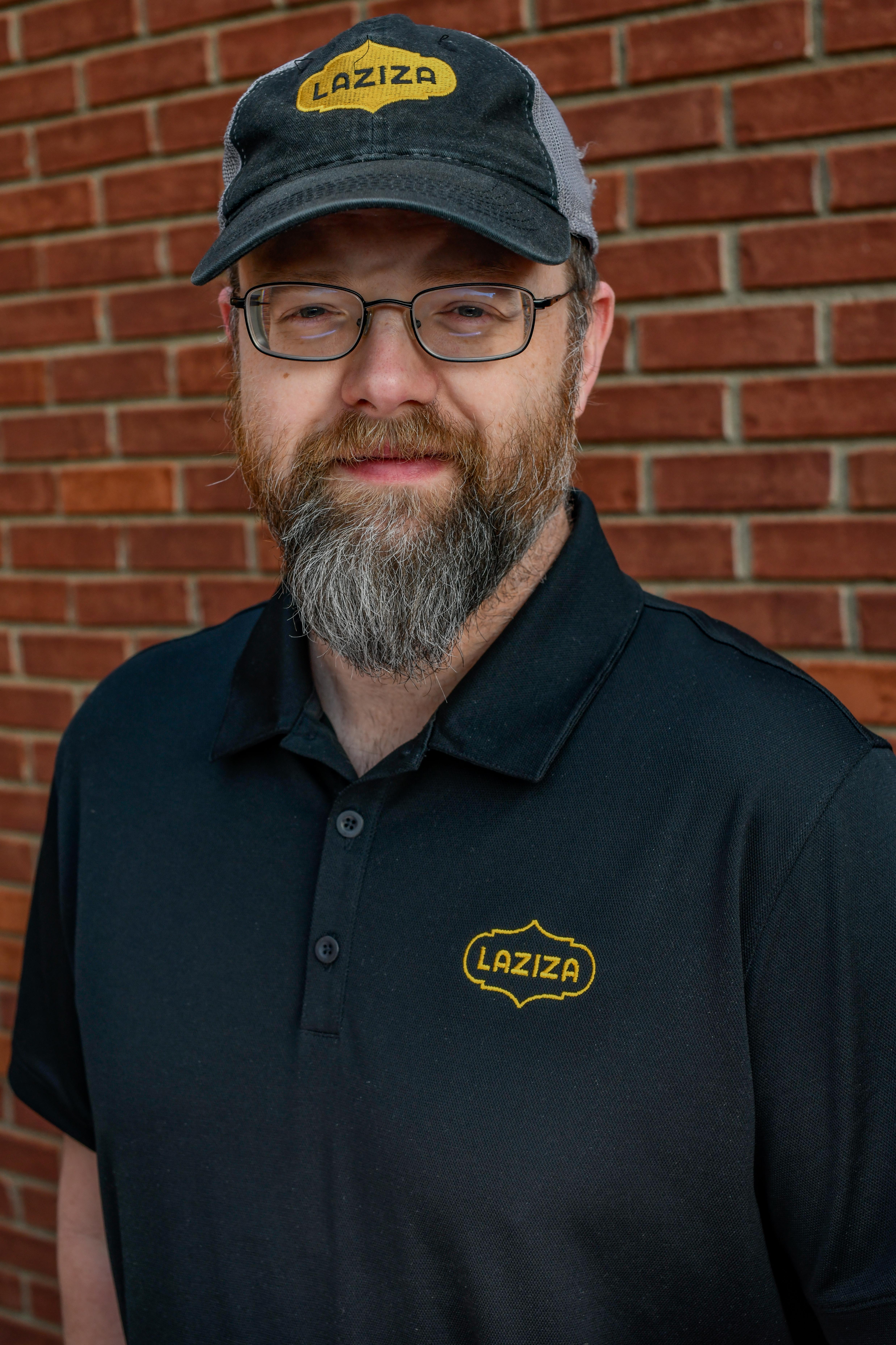a man wearing a hat and glasses