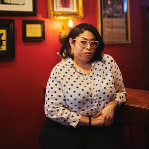a woman sitting on a table