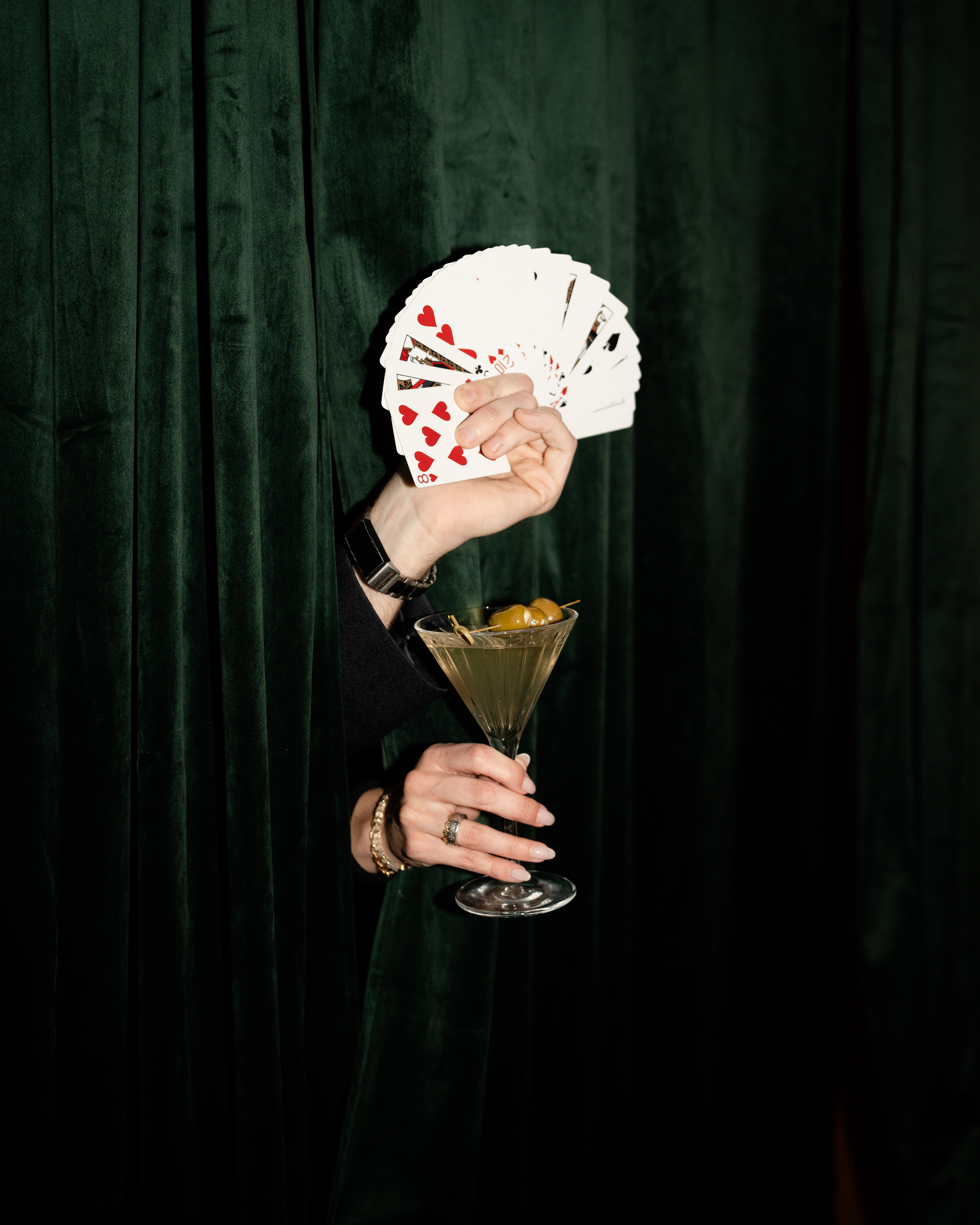 a person standing in front of a curtain