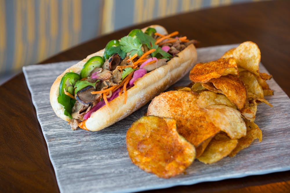 a slice of pizza sitting on top of a wooden table