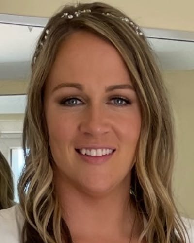 a woman smiling for the camera