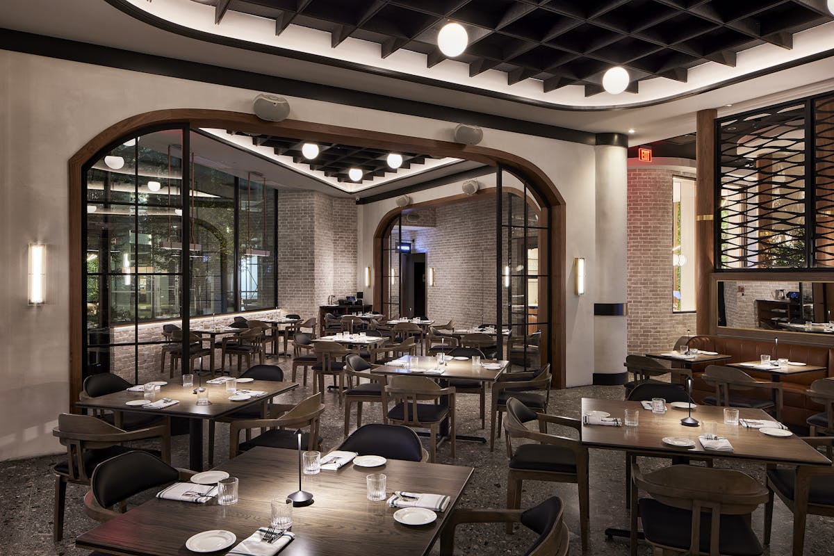 a living room filled with furniture and a large window